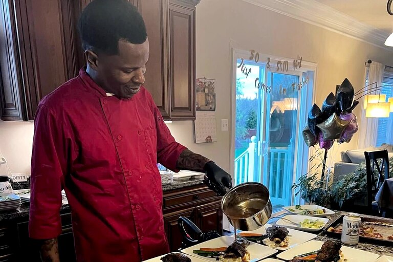 Alex Claro prepares a short rib dish.