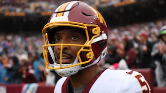 LANDOVER, MARYLAND - OCTOBER 11: Jayden Daniels #5 of the Washington Commanders looks on against the New York Giants at Northwest Stadium on October 11, 2026 in Landover, Maryland. (Photo by Patrick Smith/Getty Images)