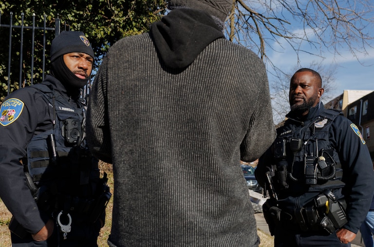 Baltimore Police officers joined medics and trained mental health counselors from the police department’s Crisis Response Team respond to a crisis call from an unhoused person in January.