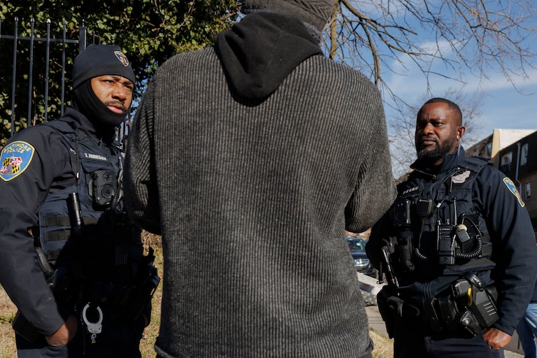 Baltimore Police officers joined medics and trained mental health counselors from the police department’s Crisis Response Team respond to a crisis call from an unhoused person in January.