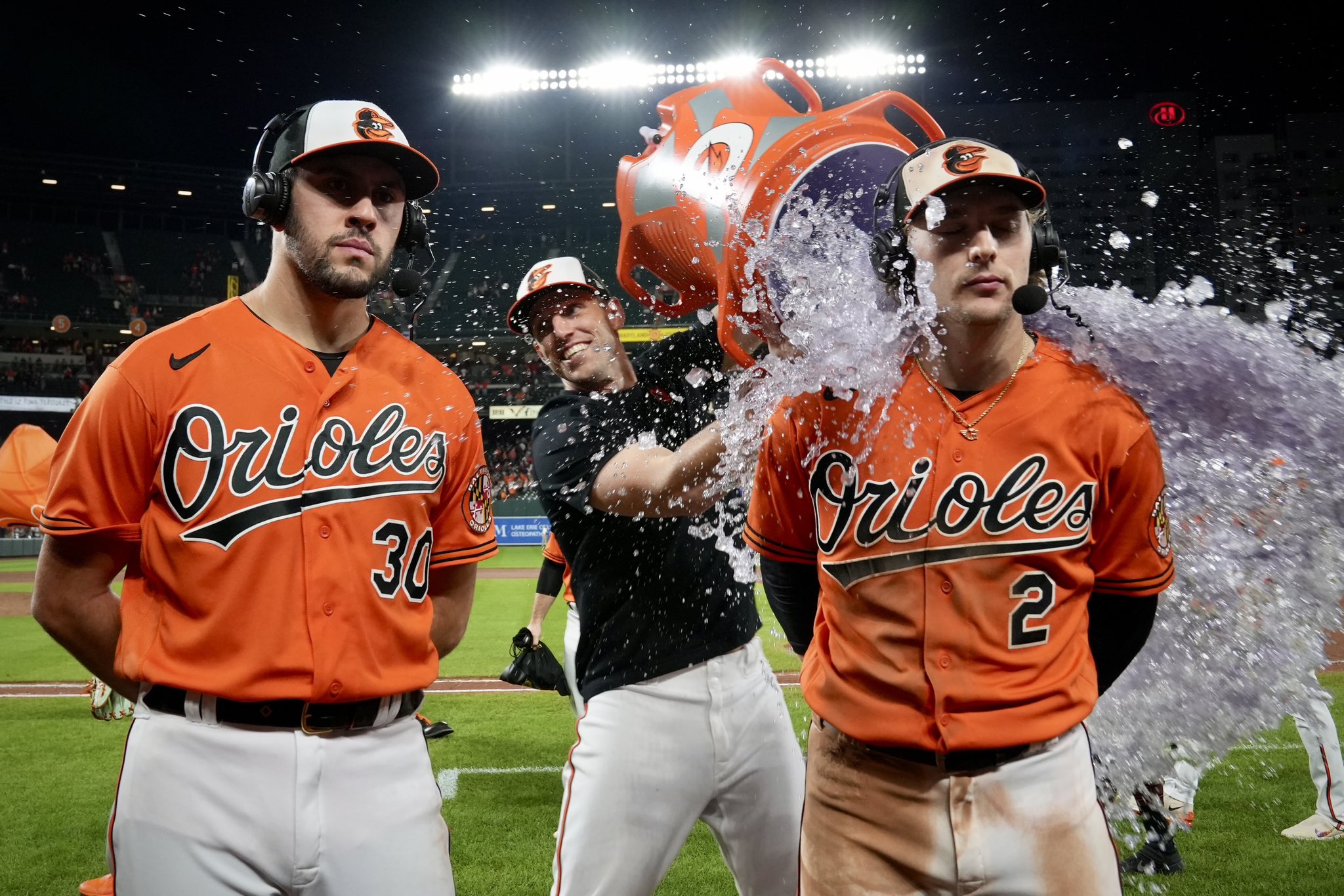 Baltimore Orioles starting pitcher Grayson Rodriguez and shortstop Gunnar Henderson get doused with water and gatorade by teammates after shutting out the Tampa Bay Rays 8-0 at Camden Yards Saturday night.