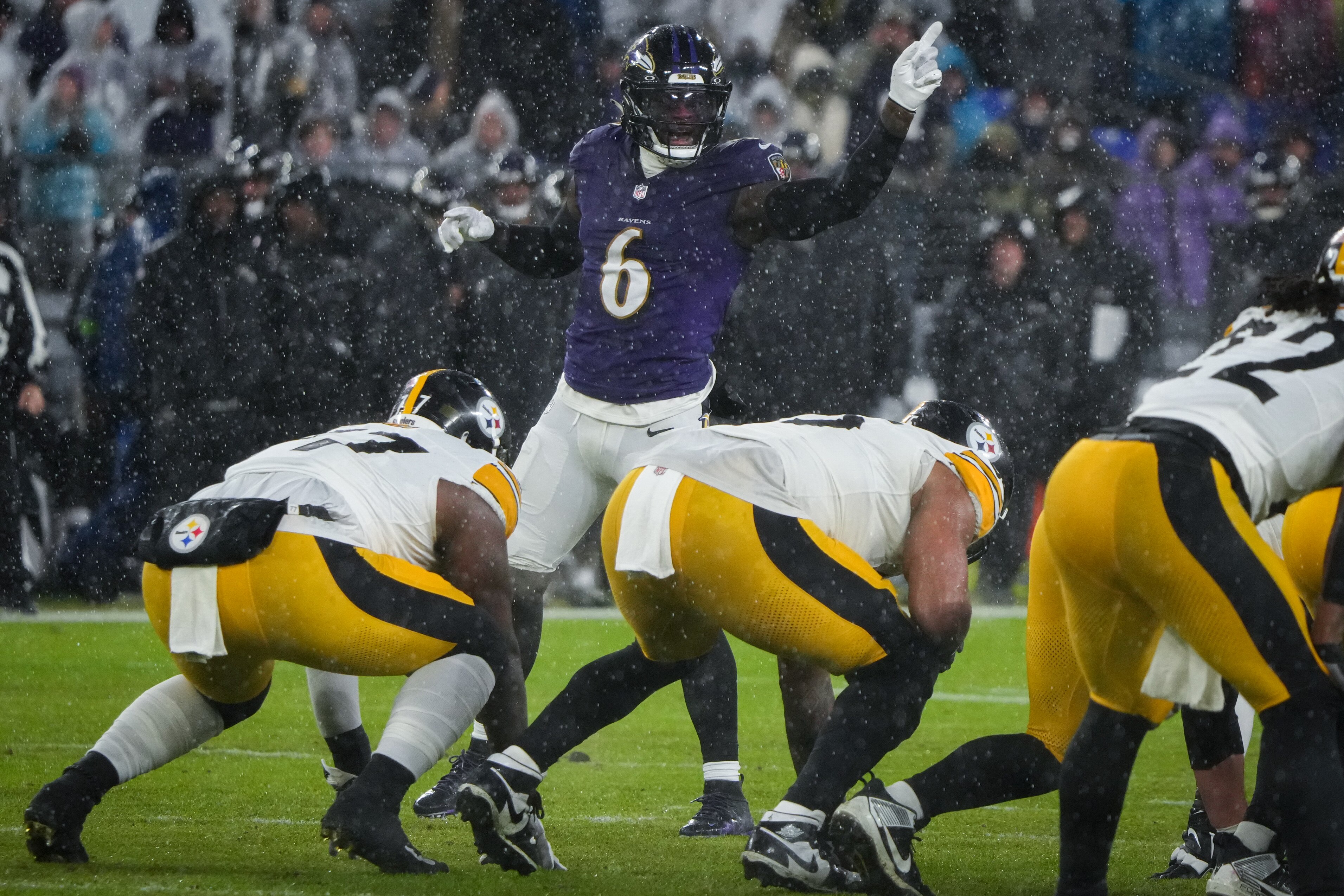 Ravens linebacker Patrick Queen shouts instructions to the defense during the team's regular-season finale Saturday.