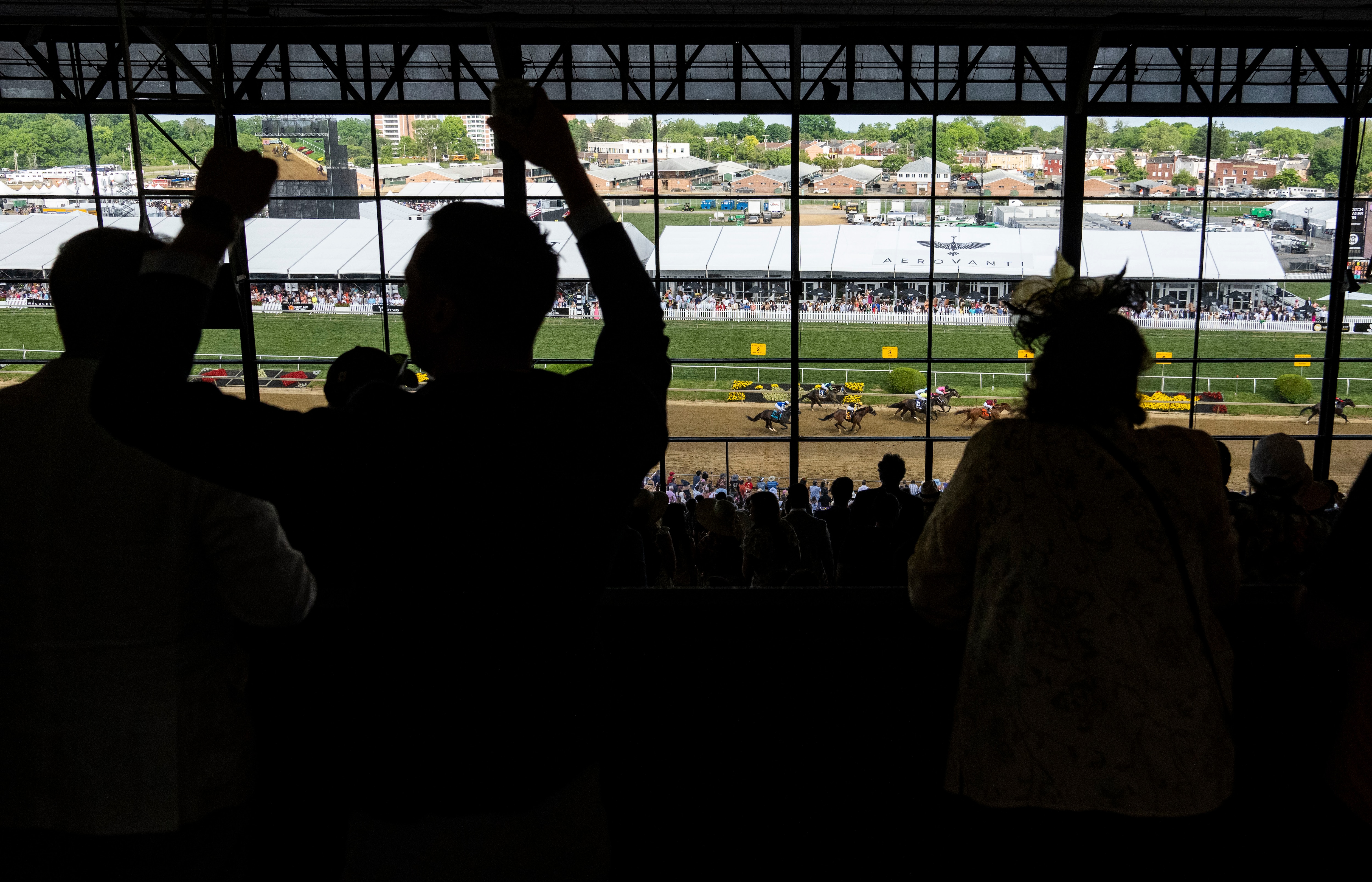 Fans celebrate a win at Pimlico Race Course in May.