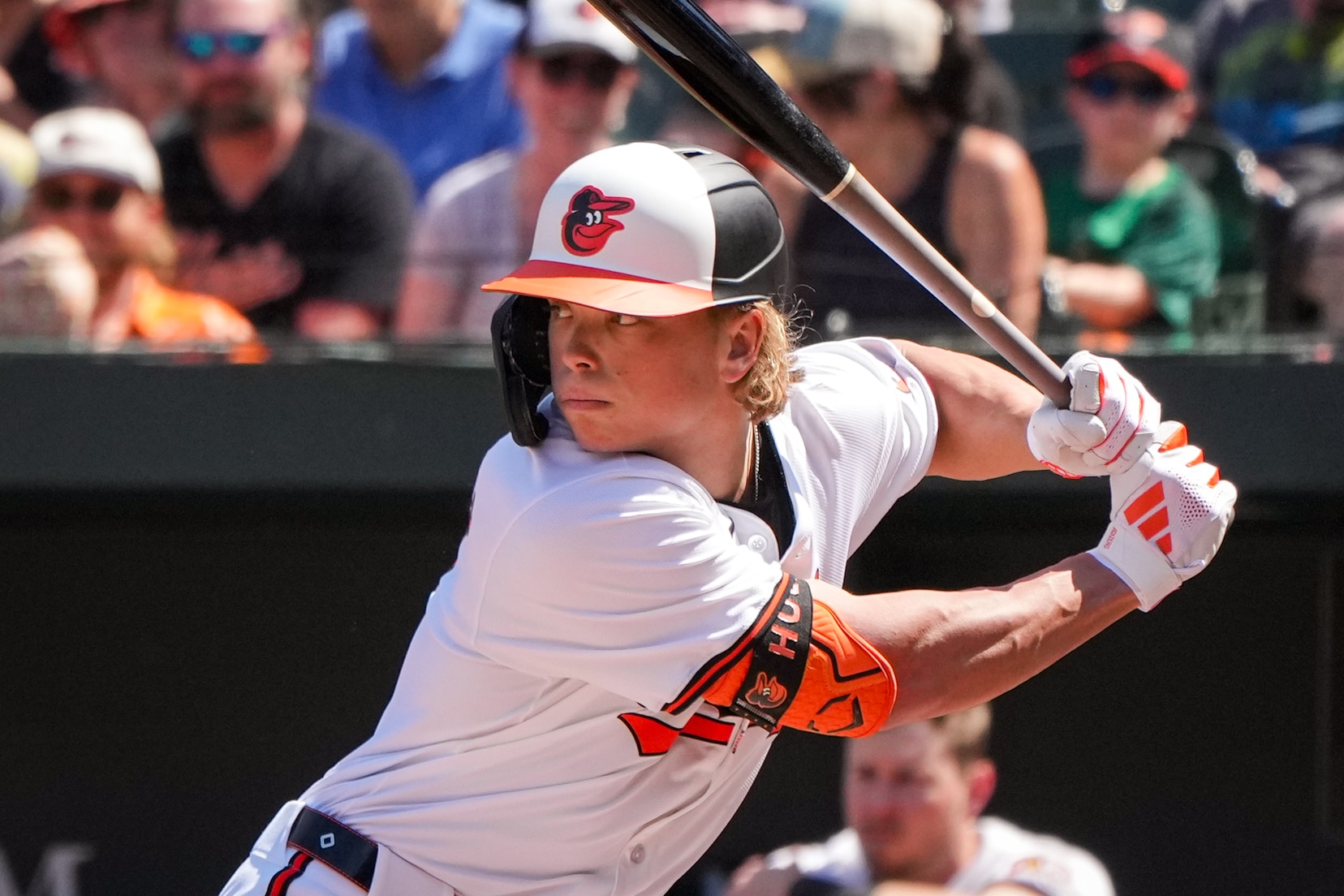 Jackson Holliday takes an at-bat against the Milwaukee Brewers in April. Some of his Topps rookie cards pay tribute to a Billy Ripken error card from 1989.
