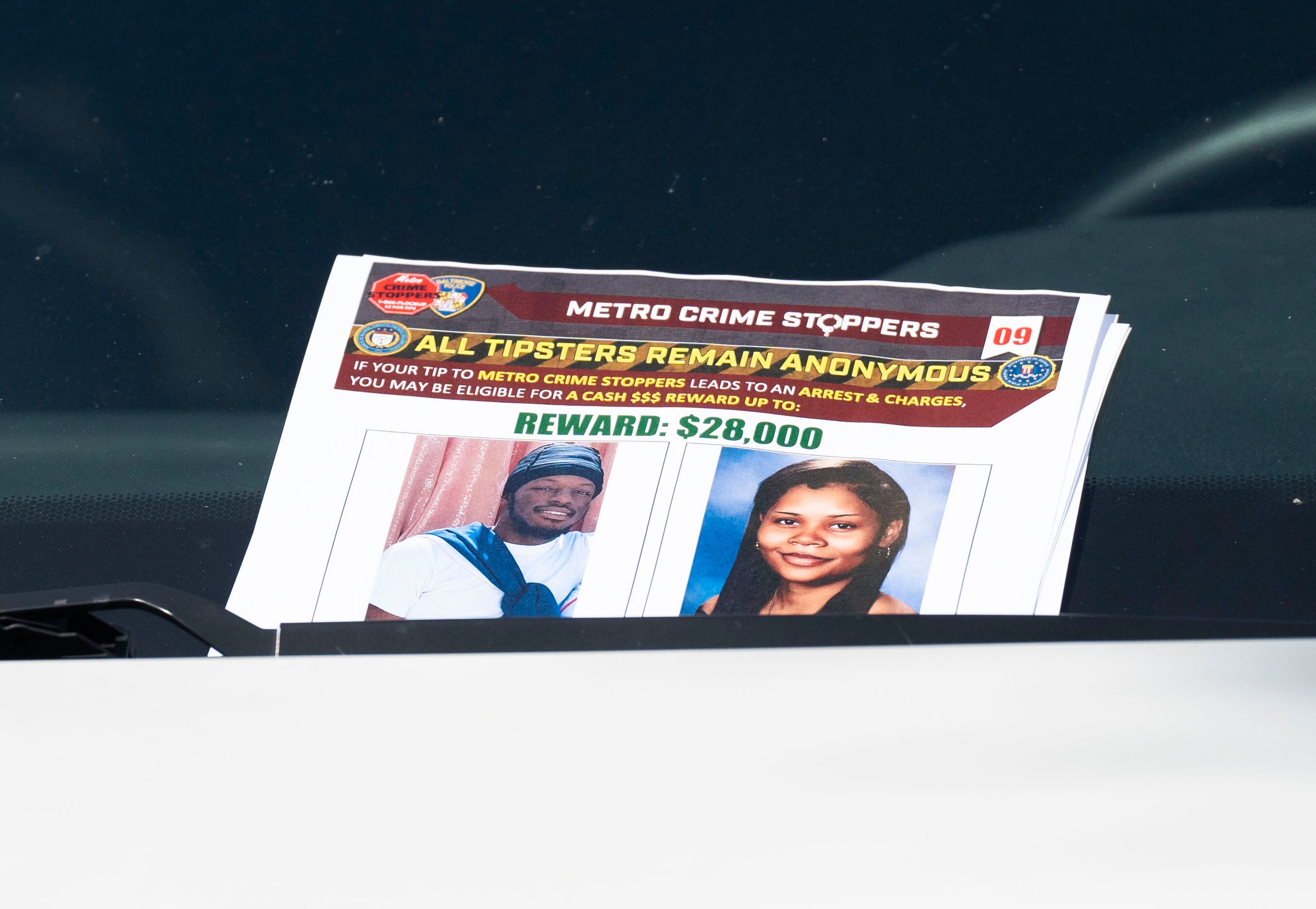 Flyers put on the windows of cars in the Brooklyn Homes, Monday, July 3, 2023. 