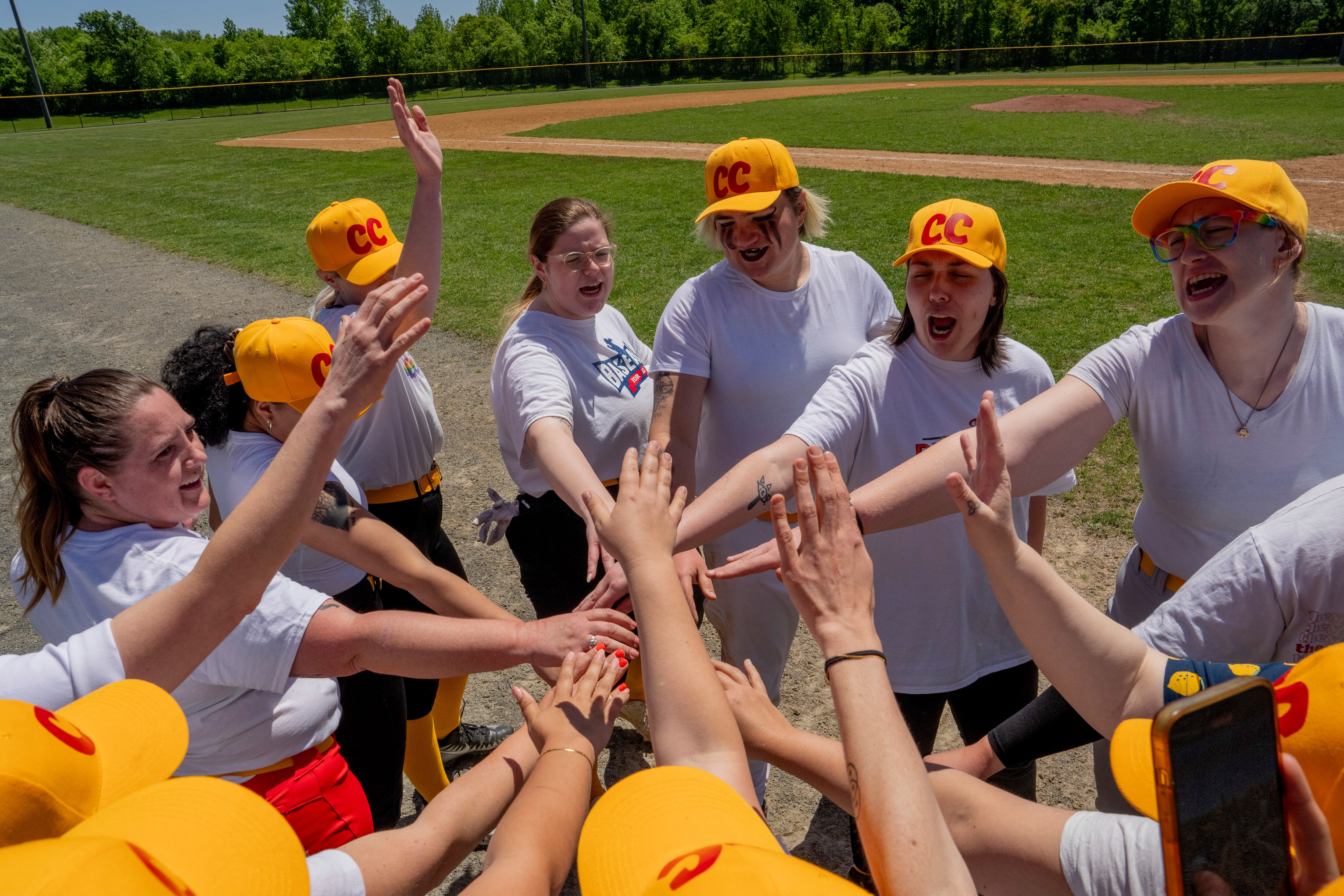 Members of the Charm City Lemon Sticks cheer after their first game of the season.
