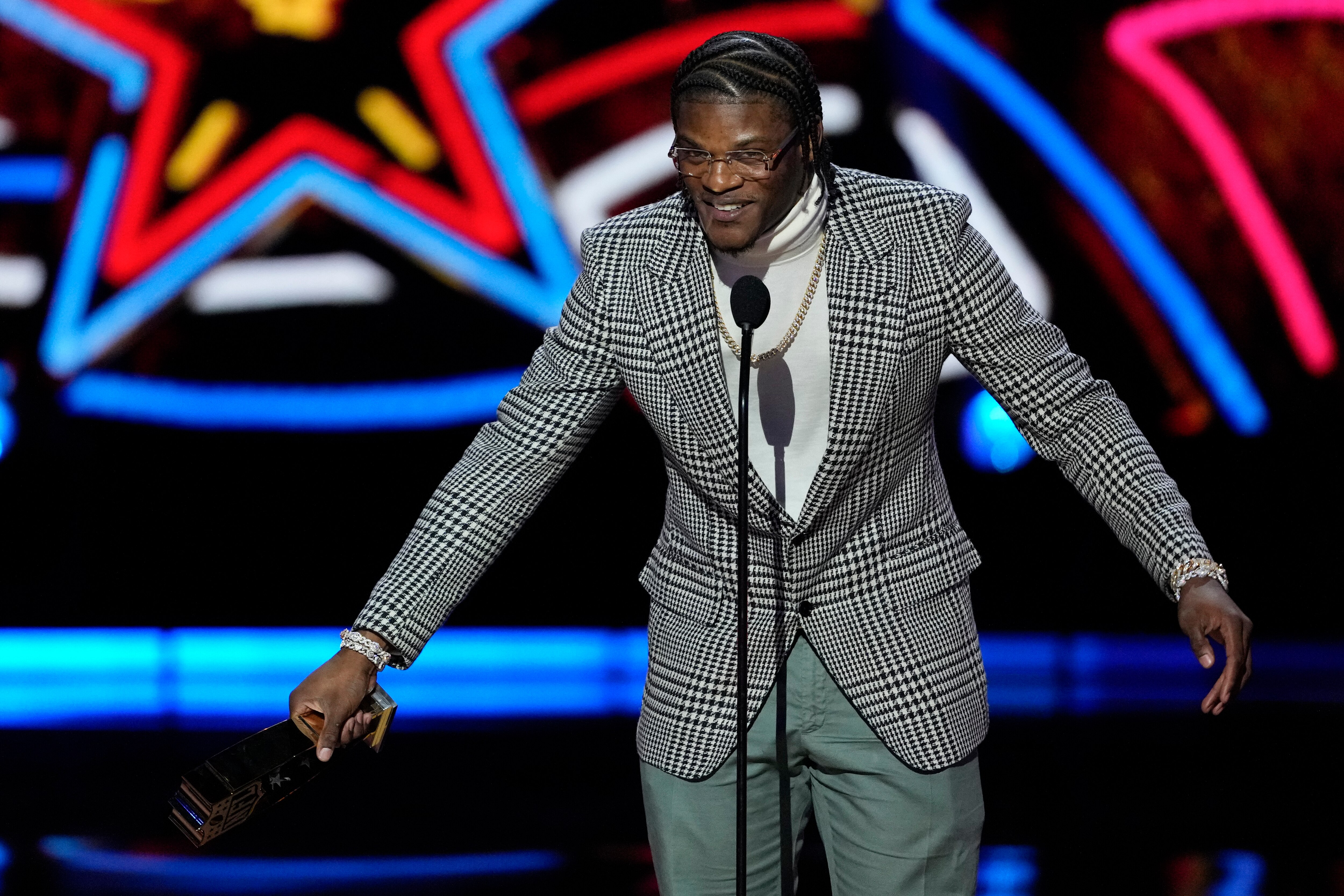 Baltimore Ravens' Lamar Jackson, AP Most valuable player speaks during the NFL Honors award show ahead of the Super Bowl 58 football game Thursday, Feb. 8, 2024, in Las Vegas. The San Francisco 49ers face the Kansas City Chiefs in Super Bowl 58 on Sunday. (AP Photo/David J. Phillip)