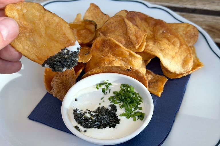 The caviar service at Bunny's Buckets & Bubbles offers a traditional approach with potato chips, crème fraîche and chives.