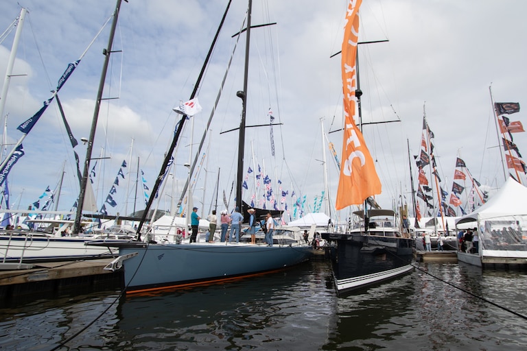Visitors take tours of sailboats docked in Downtown Annapolis during the city's Sailboat Show on Oct. 11, 2025.