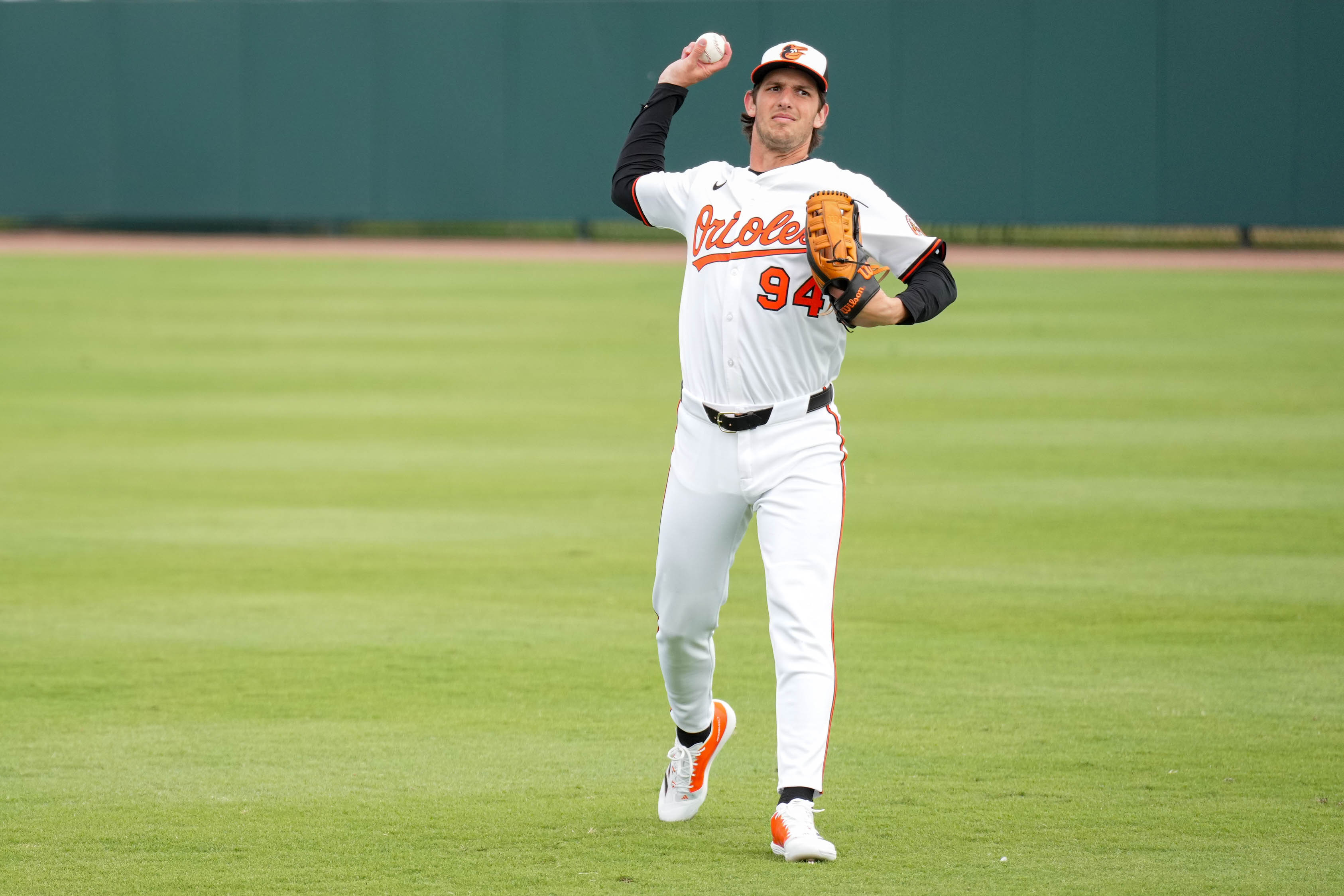 Baltimore Orioles outfielder Dylan Beavers throws to a coach in the outfield during an inning change in a Grapefruit League game against the Pittsburgh Pirates at Ed Smith Stadium in Sarasota, Fla. on Saturday, February 22, 2025.