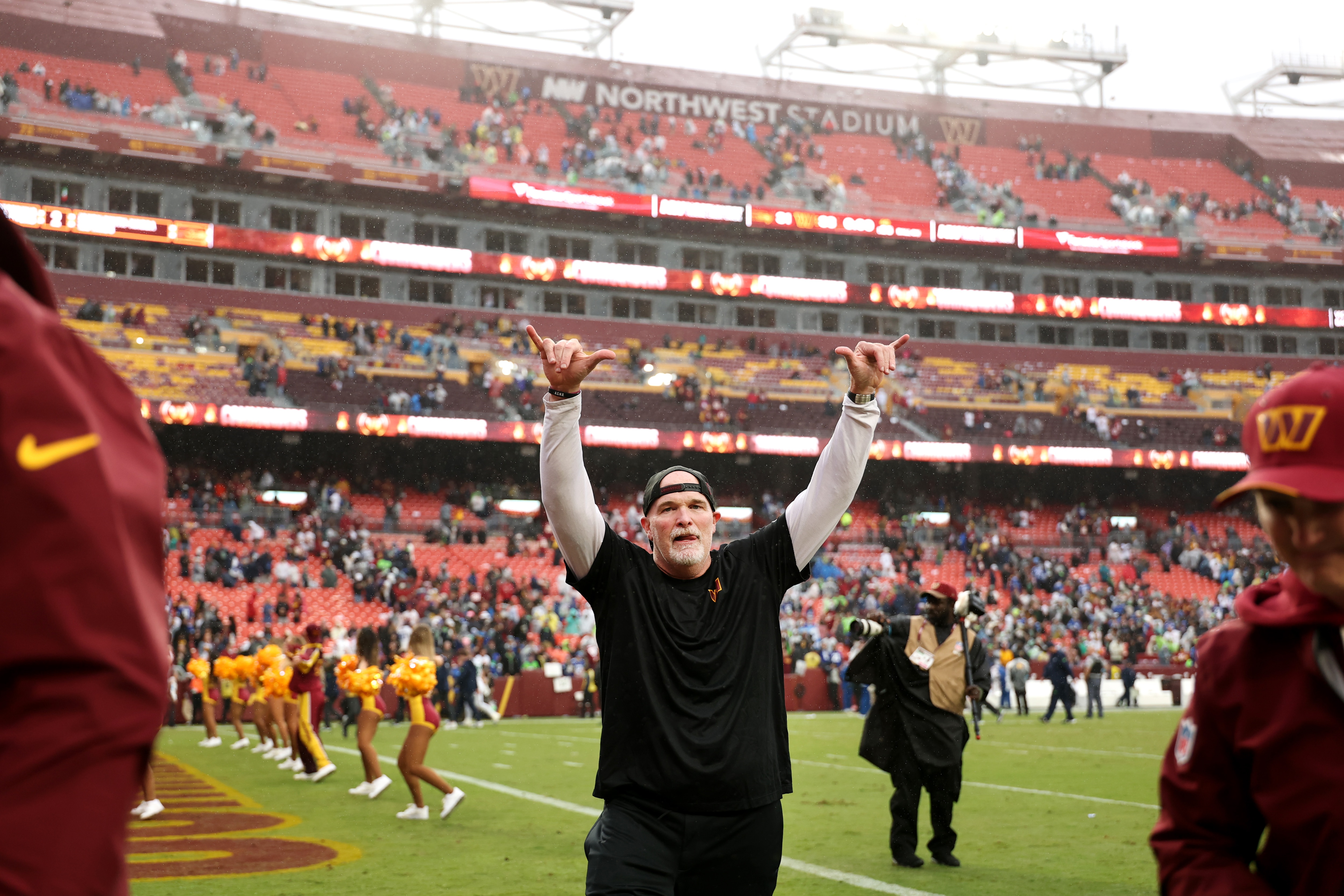 Dan Quinn celebrates the Commanders’ 33-31 win Sunday against the Seahawks at Northwest Stadium.