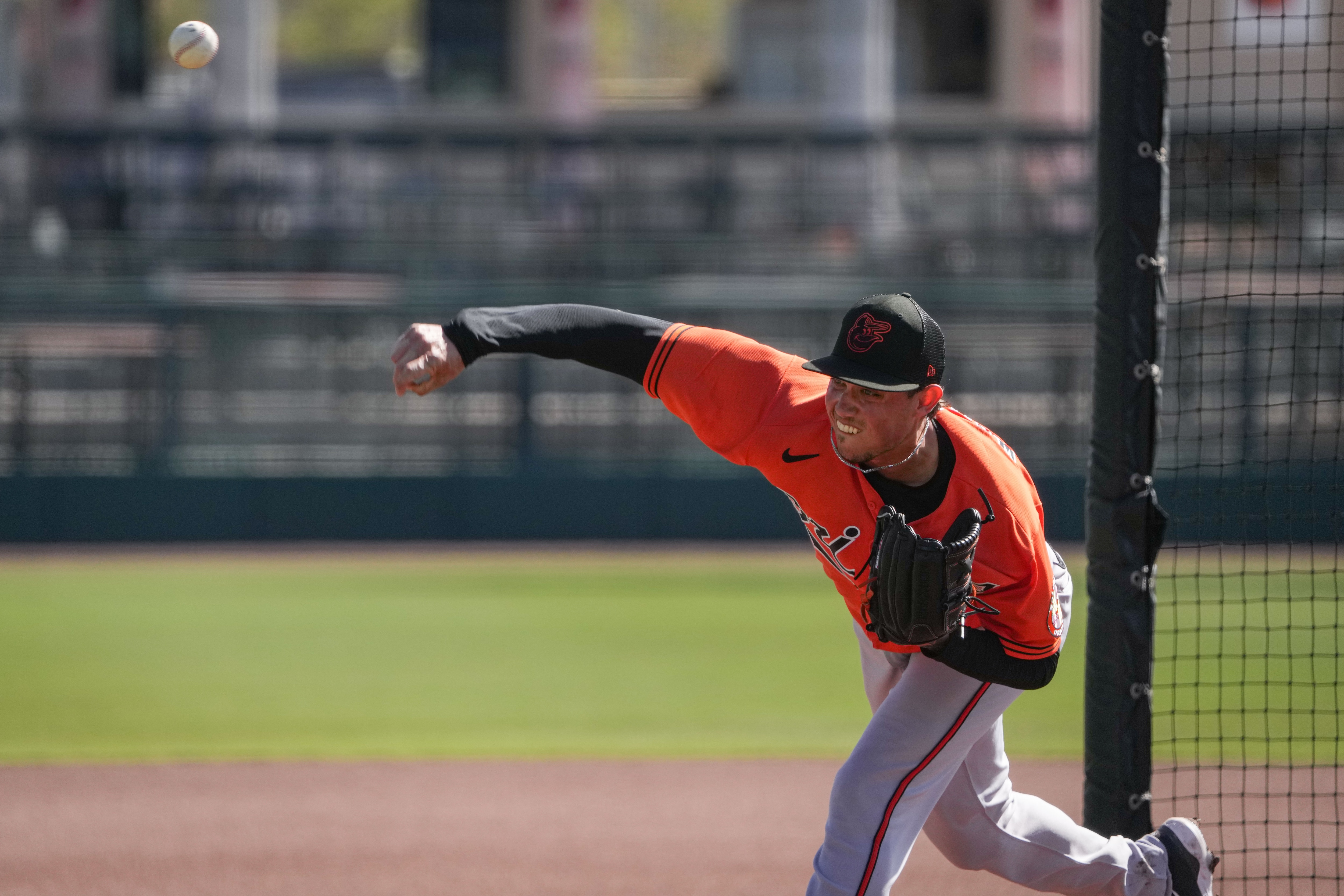 Spenser Watkins (52) delivers a pitch during batting practice at Ed Smith Stadium in Sarasota on 2/22/23. The Baltimore Orioles’ Spring Training session runs from mid-February through the end of March.