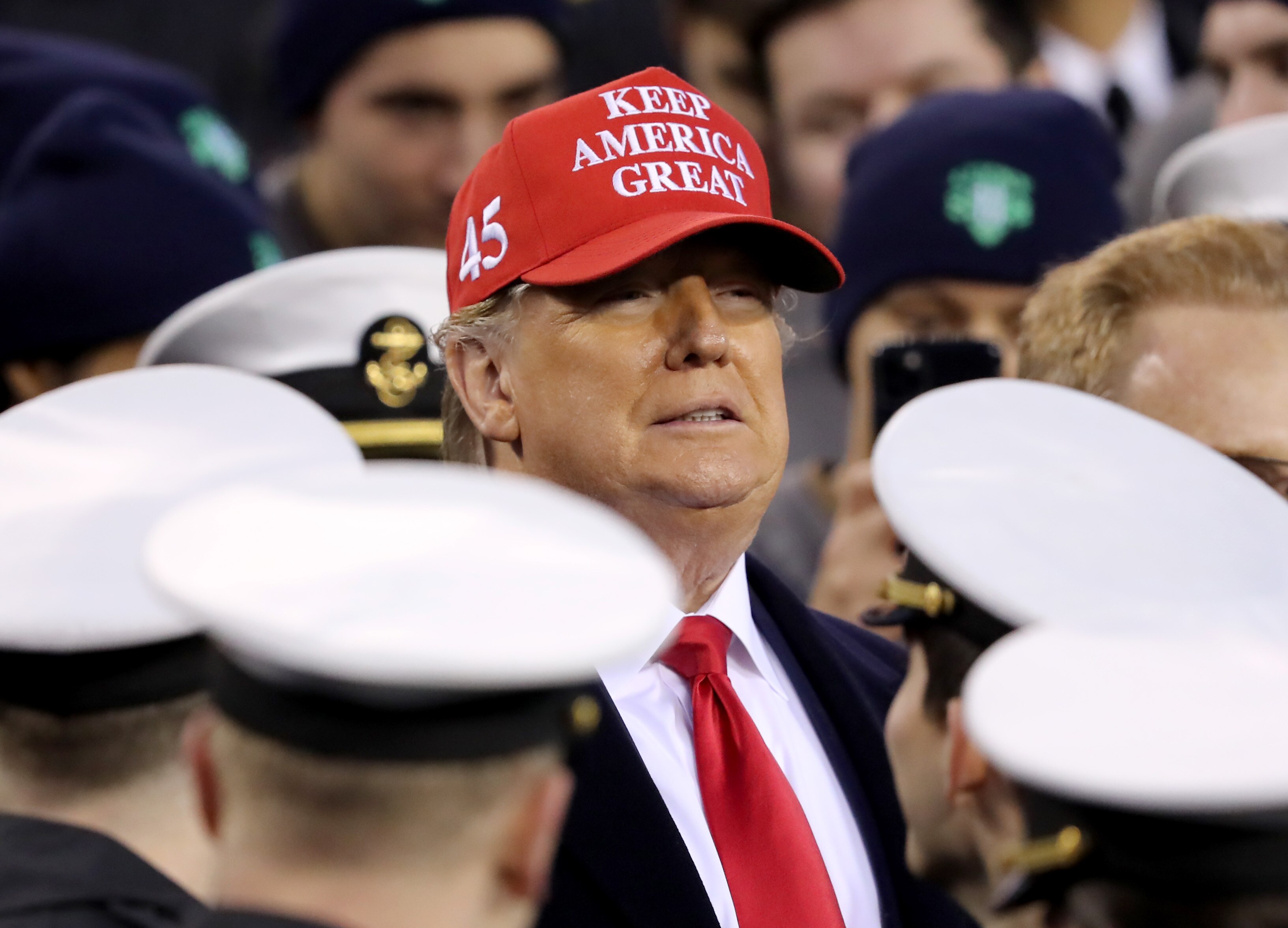 President Donald Trump stands on the Navy side of the field to start the second half of the Army-Navy game at Lincoln Financial Field on Dec. 14, 2019 in Philadelphia, Pennsylvania.