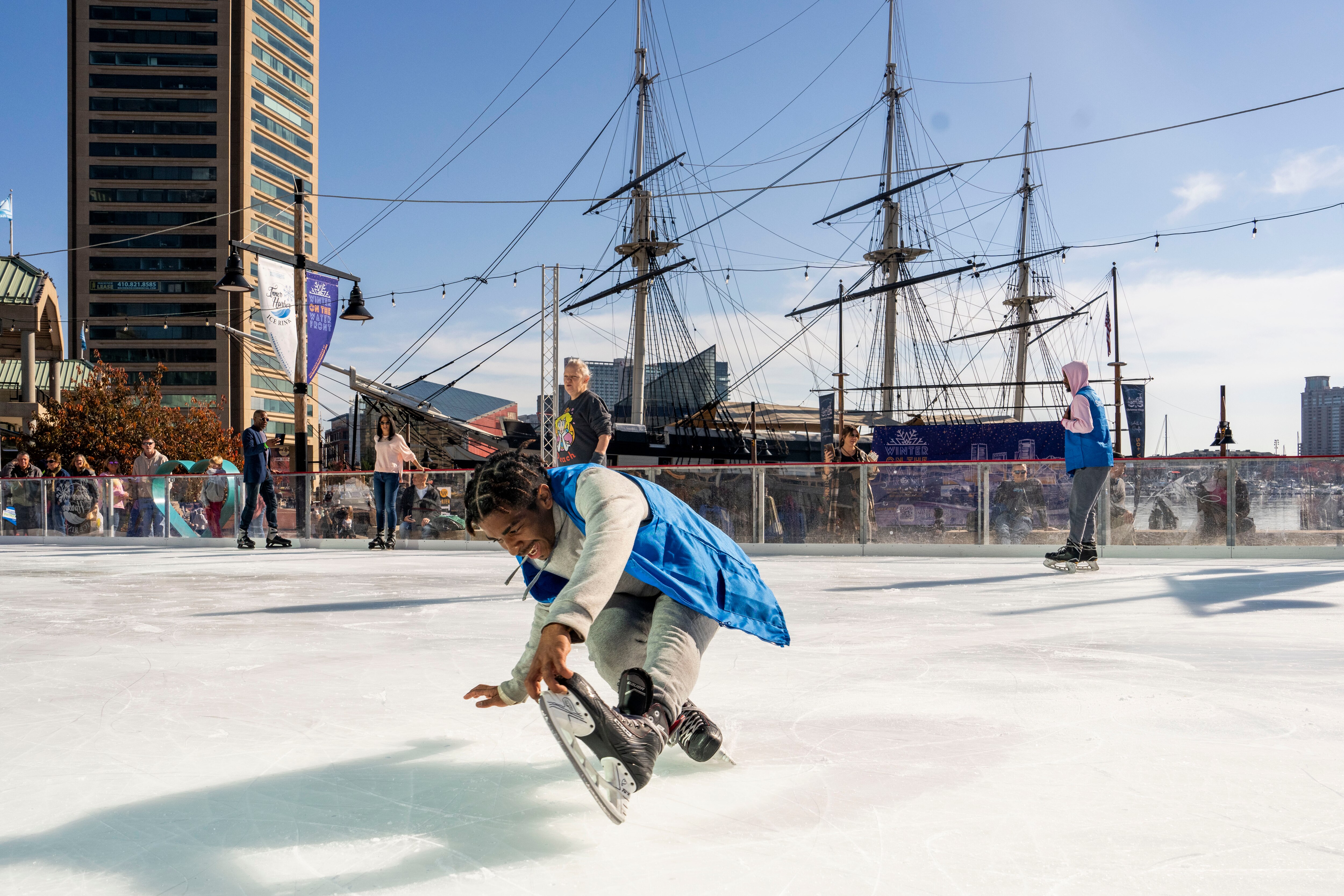 Staff guard Jonathana Mann shows off some tricks at the Inner Harbor Ice Rink on Nov. 11, 2023.