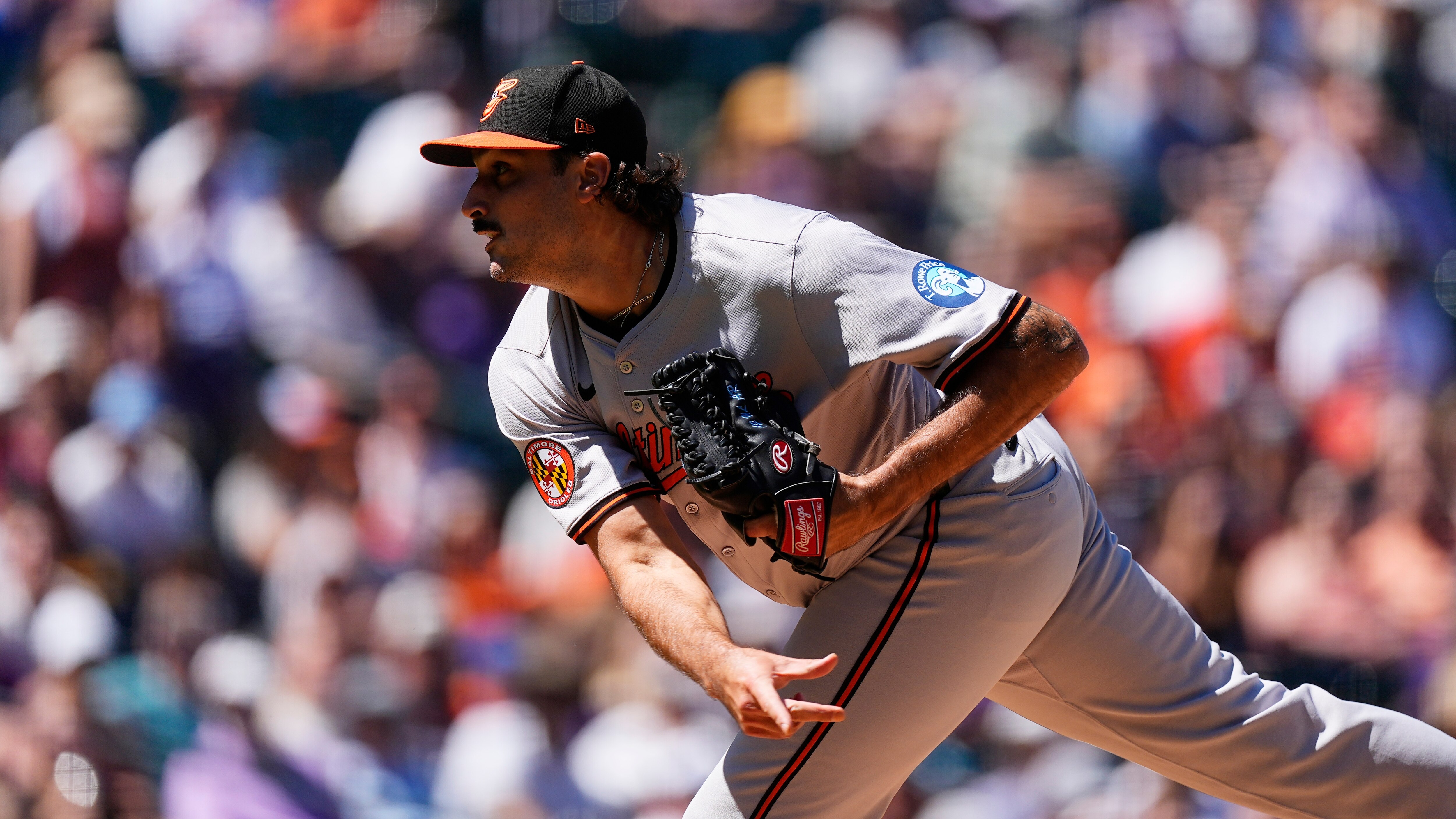 Baltimore Orioles starting pitcher Zach Eflin works against the Colorado Rockies in the first inning of a baseball game Sunday, Sept. 1, 2024, in Denver. (AP Photo/David Zalubowski)