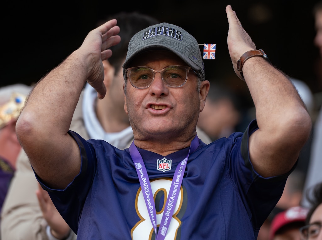 A ravens fan nervously watches the second half of the Ravens and Titians game in Tottenham Hotspur Stadium on Oct. 15, 2023.