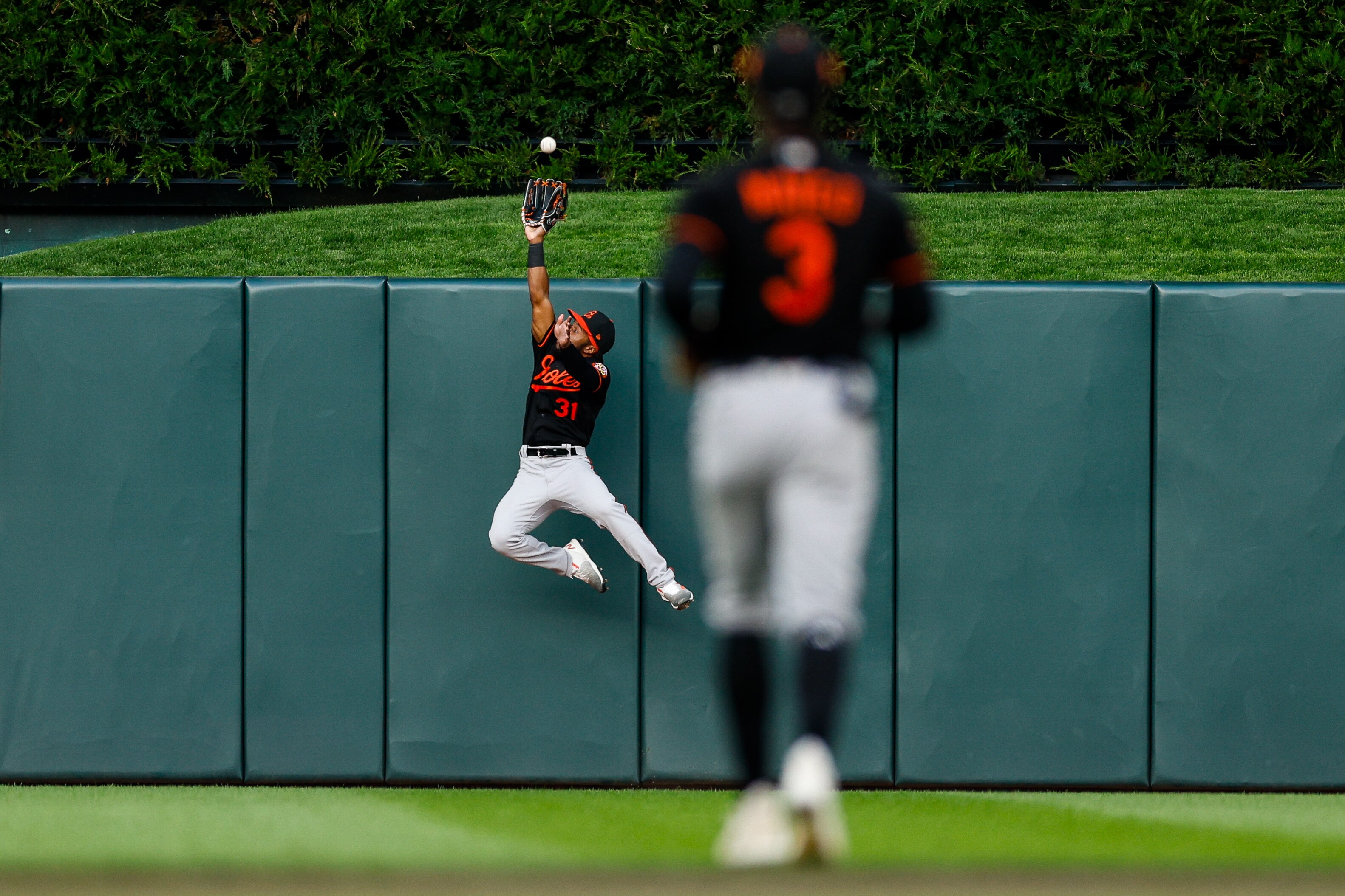 Orioles center fielder Cedric Mullins takes a home run away from the Twins' Byron Buxton in the fourth inning of Baltimore's 3-1, 10-inning victory.