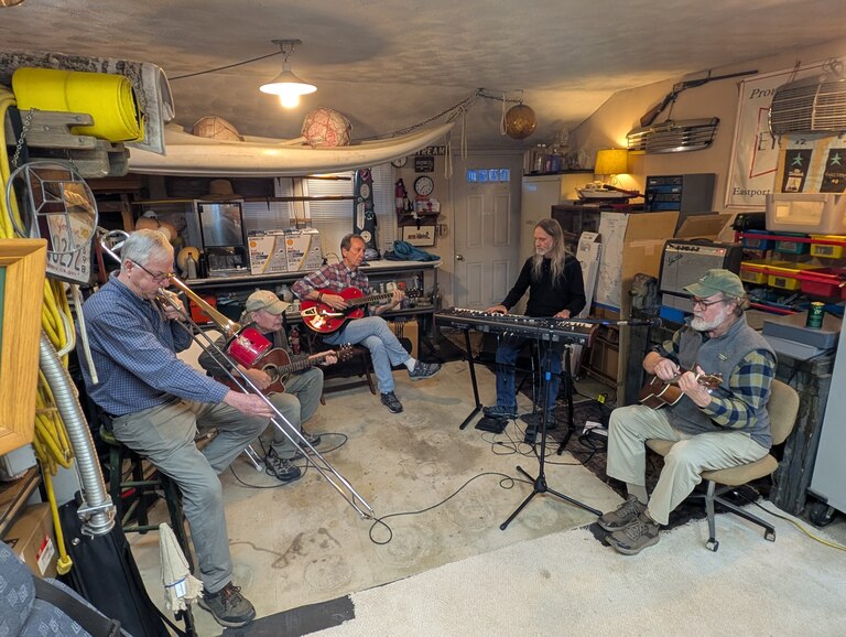 The Eastport Oyster Boys denies ever rehearsing, calling its sessions in member Andy Fegley's machine shed just occasional practice. From left, Fegley, Kevin Brooks, Tom Guay, Mike Lange are joined by former member Jeff Holland.