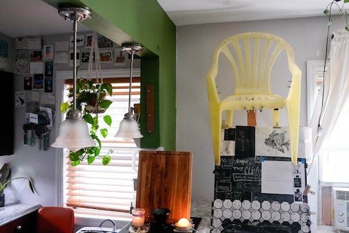 Dan Ortiz Leizman, an artist and lecturer at the University of Maryland, College Park displays one of their homemade Monobloc Chair Harps in their home in Hyattsville, Md. on Wednesday, June 10, 2026.