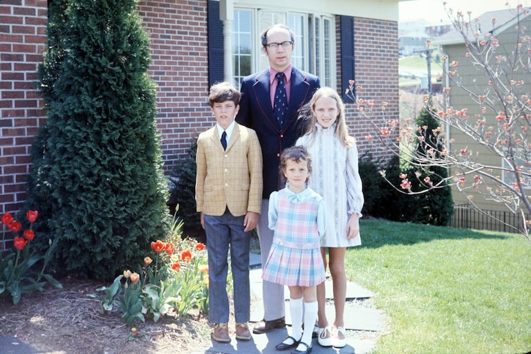 John O’Hagan with his children, John, Mary Pat and Kathy, in front of their house in Springdale.