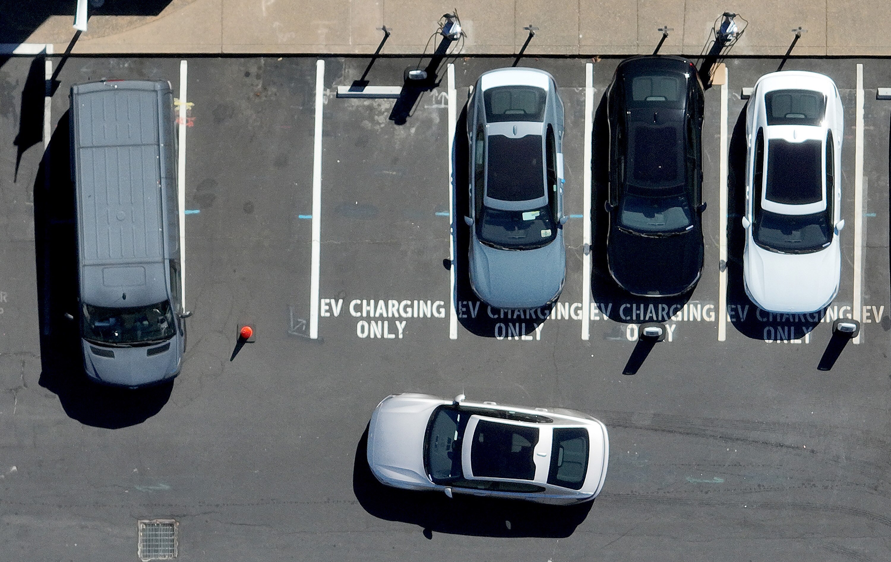 CORTE MADERA, CALIFORNIA - JULY 28: A Polestar electric car prepares to park at an EV charging station on July 28, 2023 in Corte Madera, California. Seven major automakers announced plans earlier this week to increase the number of high-powered electric vehicle chargers in the country with 30,000 new charging stations along highways and in urban areas. According to the Energy Department, there are currently an estimated  32,000 chargers across the country.