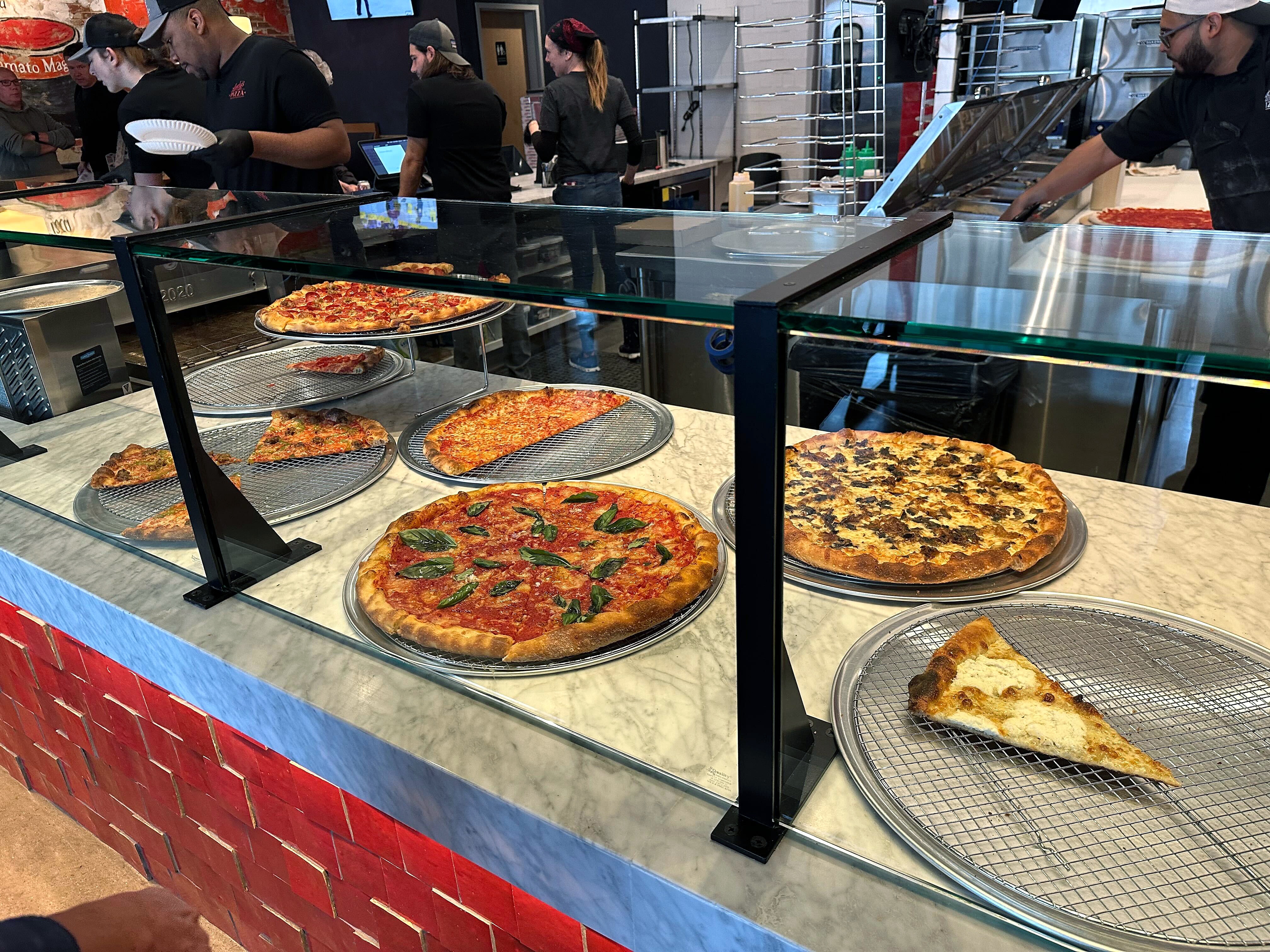 Aside from the traditional cheese, pepperoni and mushroom slices, Andy’s offers a selection of pricier specialty pies, including the fan-favorite pepperoni special with burrata, basil and a drizzle of hot honey. Taken on Wednesday, November 19, 2025.