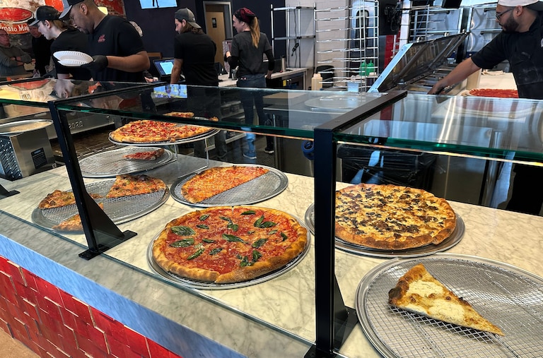 Aside from the traditional cheese, pepperoni and mushroom slices, Andy’s offers a selection of pricier specialty pies, including the fan-favorite pepperoni special with burrata, basil and a drizzle of hot honey. Taken on Wednesday, November 19, 2025.