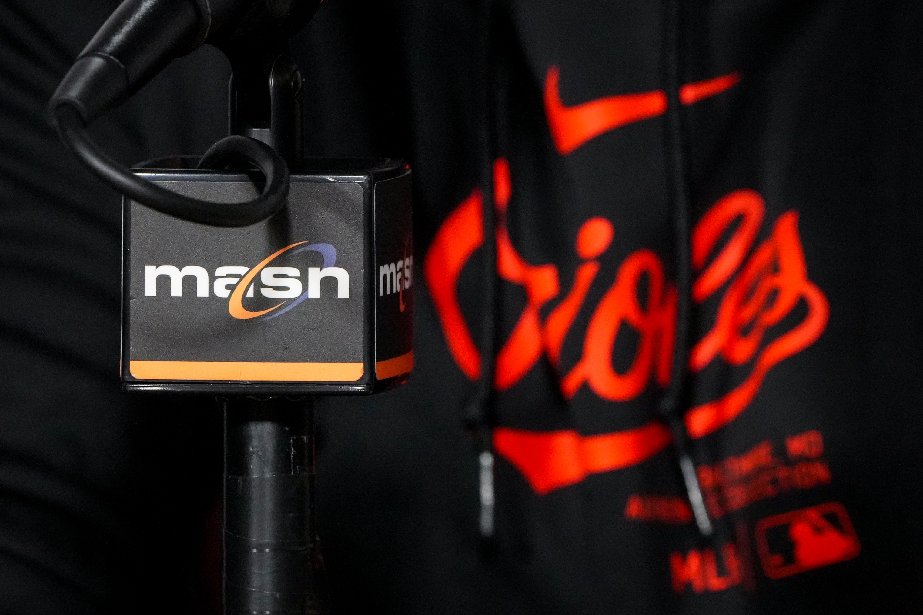 The MASN logo is seen on a microphone during Baltimore Orioles Manager Brandon Hyde’s post-game press conference following a loss to the Los Angeles Angels at Camden Yards on March 31, 2024. The Orioles lost the Angels, 4-1, on Sunday afternoon.