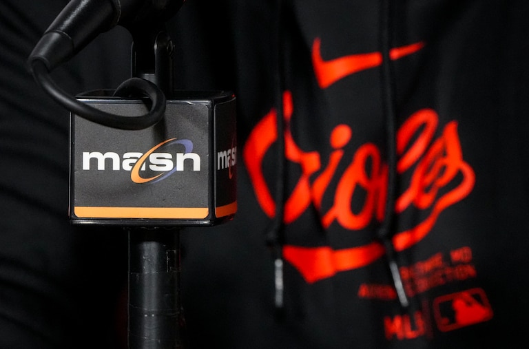 The MASN logo is seen on a microphone during Baltimore Orioles Manager Brandon Hyde’s post-game press conference following a loss to the Los Angeles Angels at Camden Yards on March 31, 2024. The Orioles lost the Angels, 4-1, on Sunday afternoon.