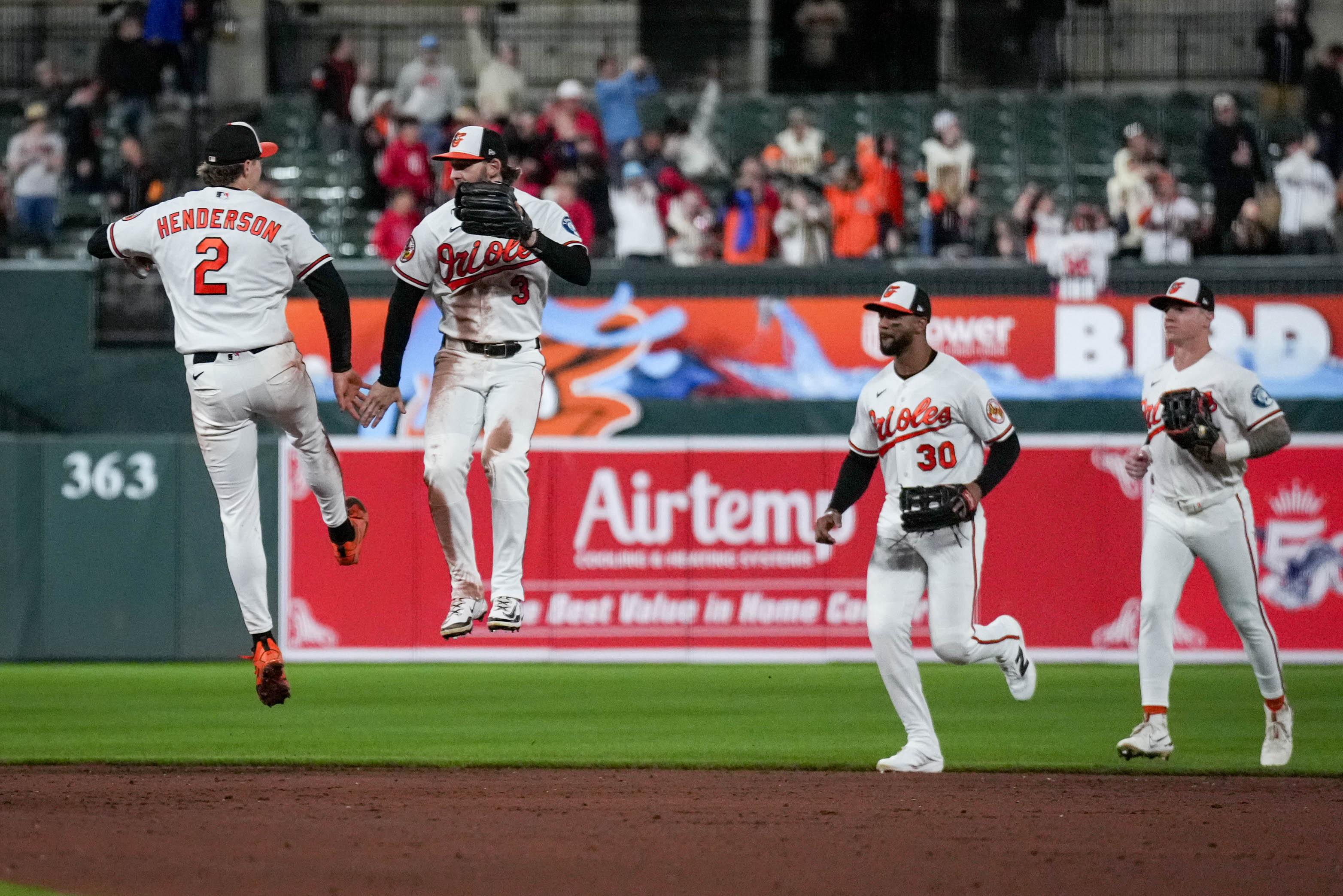 Baltimore Orioles shortstop Gunnar Henderson (2) and left fielder Taylor Ward (3) leap in the air to celebrate their win against the Houston Astros at Oriole Park at Camden Yards in Baltimore, Md. on Tuesday, April 28, 2026.