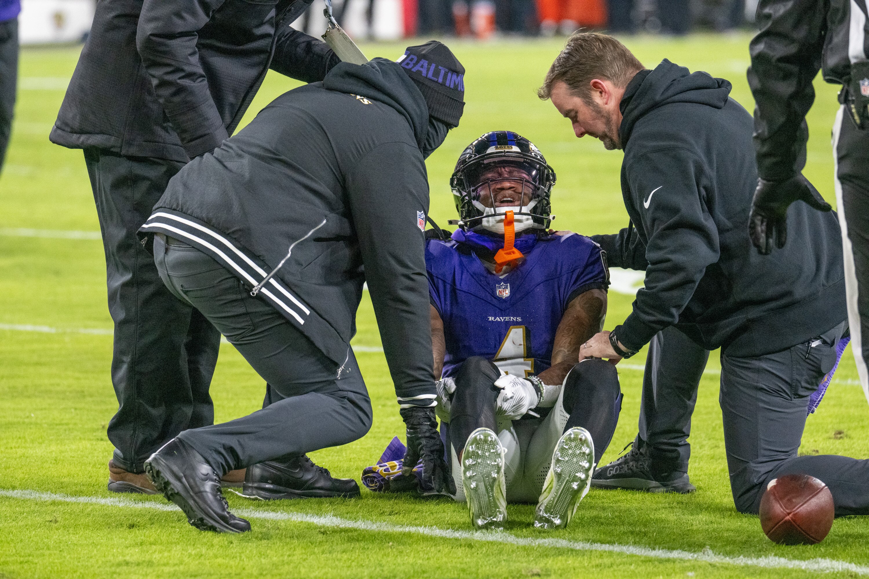 Baltimore Ravens wide receiver Zay Flowers (4) winces in pain after being injured in the 2nd quarter.The Baltimore Ravens host the Cleveland Browns at M&T Bank Stadium on Saturday, January 4, 2025.