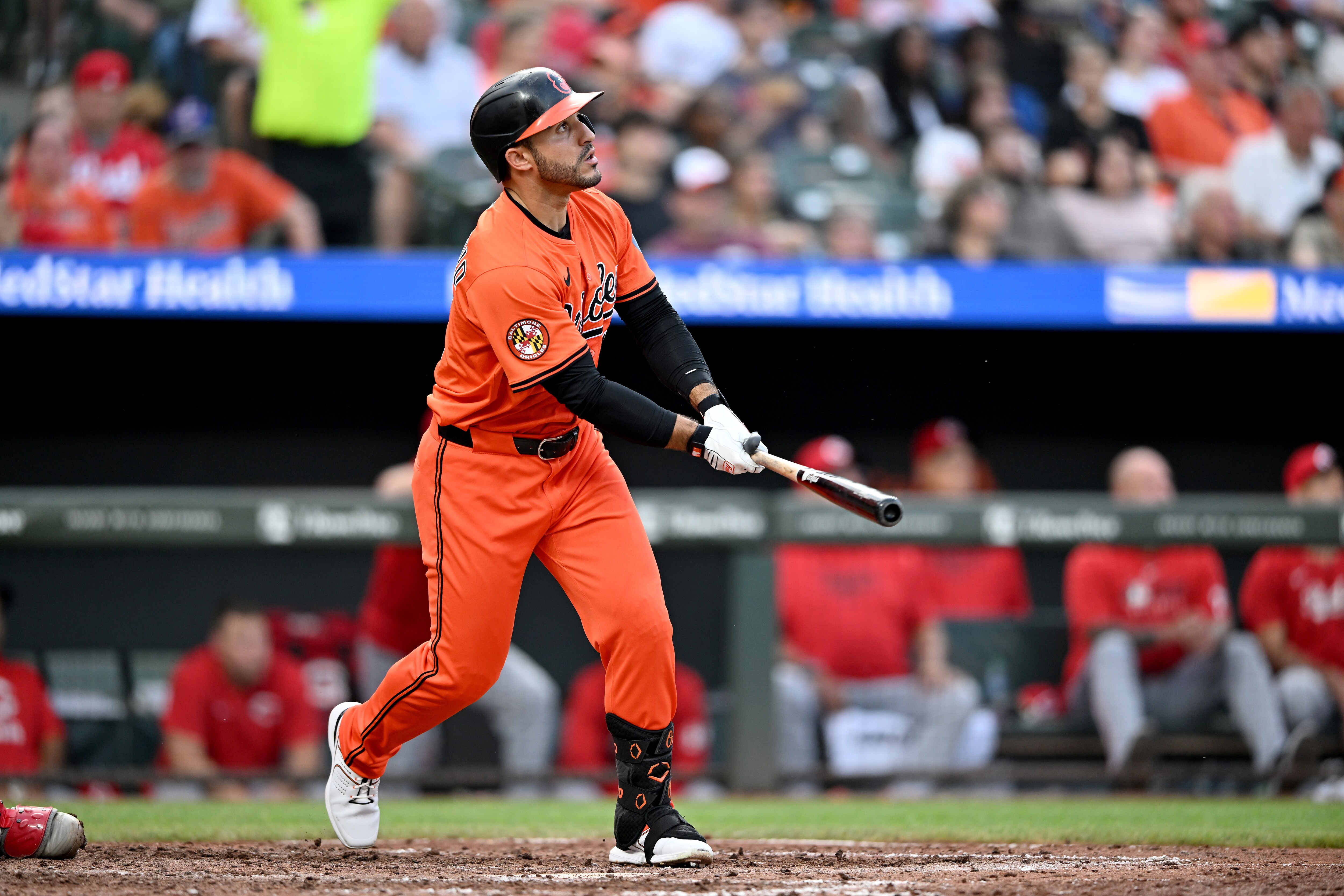 BALTIMORE, MARYLAND - APRIL 19: Ramón Laureano #12 of the Baltimore Orioles hits a home run in the seventh inning against the Cincinnati Reds at Oriole Park at Camden Yards on April 19, 2025 in Baltimore, Maryland.
