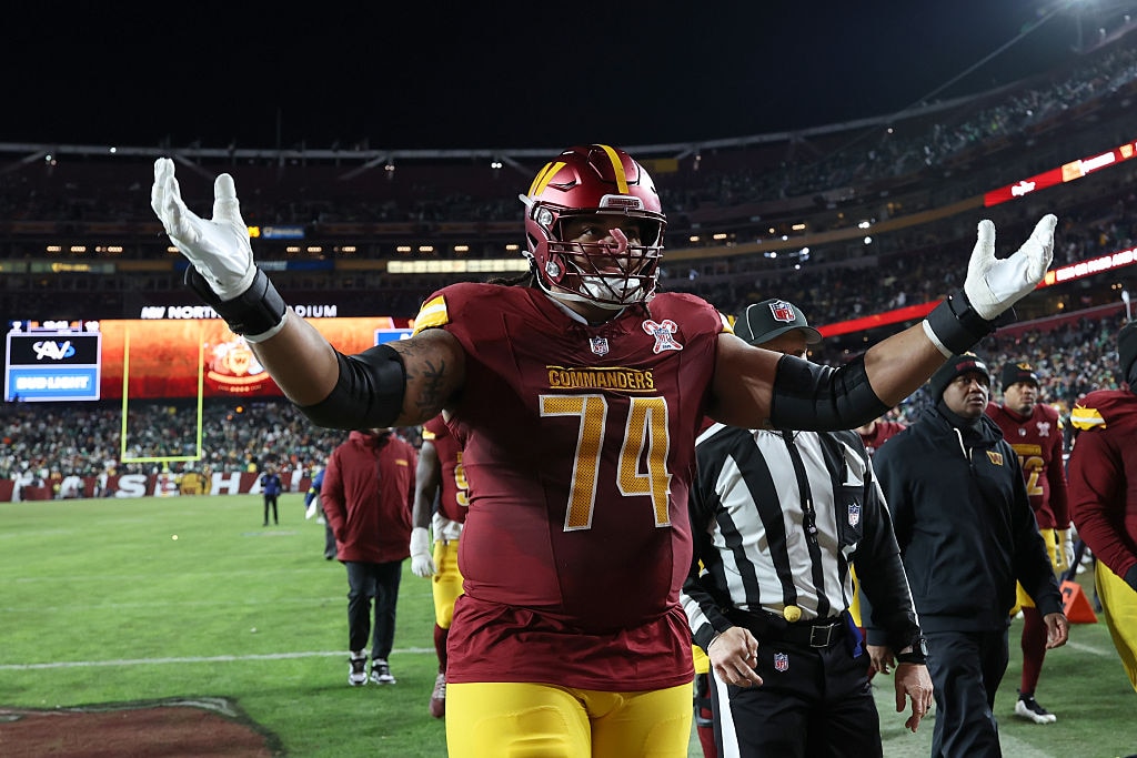 Washington Commanders offensive lineman Brandon Coleman celebrates during halftime of the team's Week 16 game against the Philadelphia Eagles.