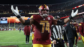 Washington Commanders offensive lineman Brandon Coleman celebrates during halftime of the team's Week 16 game against the Philadelphia Eagles.