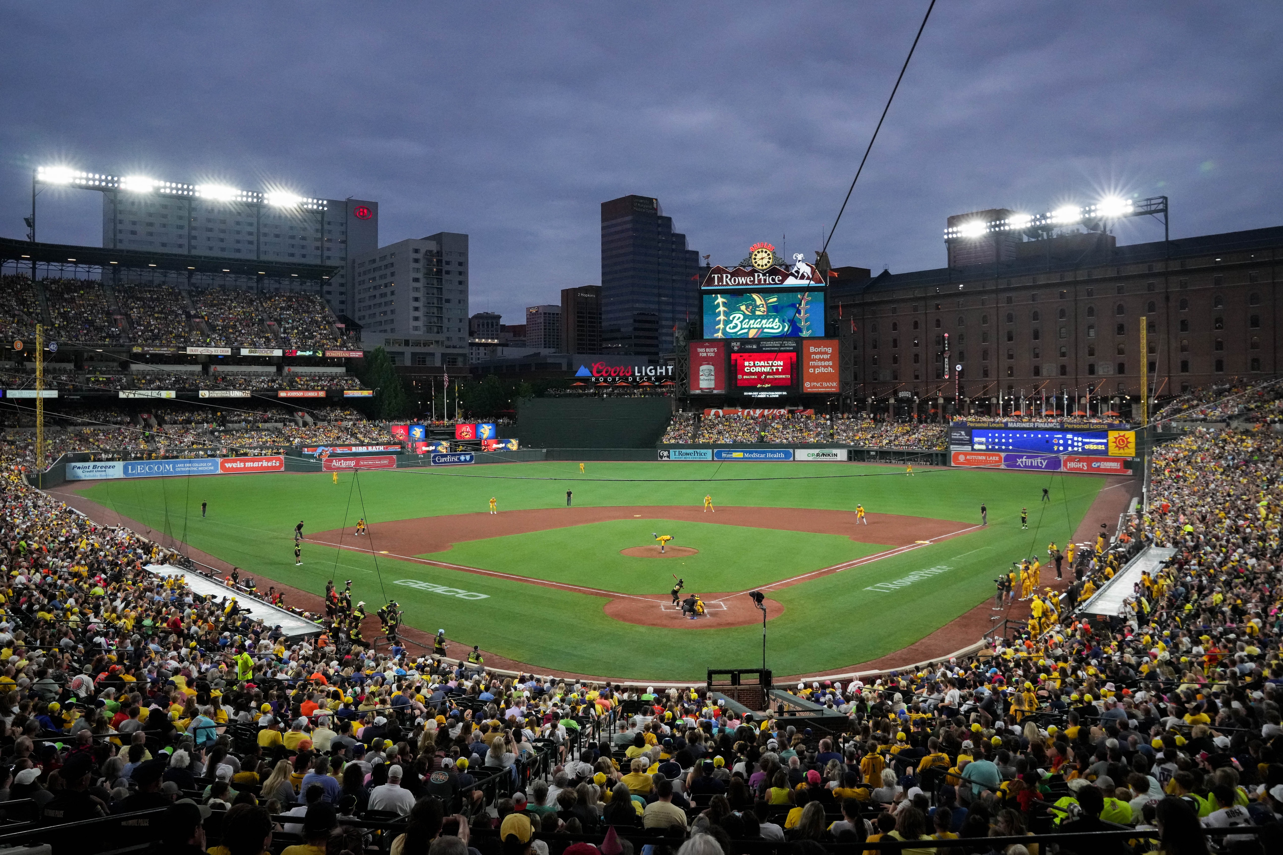 A sold out crowd cheers during a Banana Ball game between the Savannah Bananas and The Firefighters at Oriole Park at Camden Yards in Baltimore, Md. on Friday, August 1, 2025. It’s the first of two games to be played at Camden Yards this weekend.