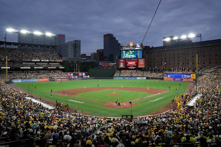 A sold out crowd cheers during a Banana Ball game between the Savannah Bananas and The Firefighters at Oriole Park at Camden Yards in Baltimore, Md. on Friday, August 1, 2025. It’s the first of two games to be played at Camden Yards this weekend.