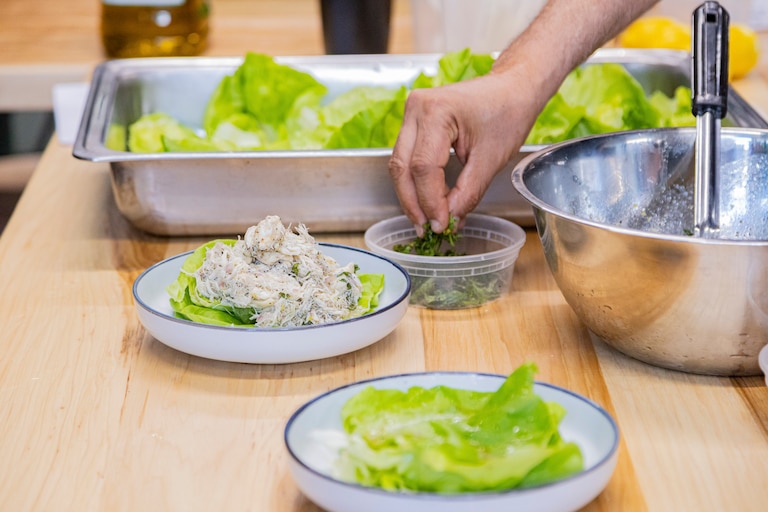 WEDNESDAY, AUGUST 19, 2026 - the crab salad is plated and garnished with a bit of mint. This is the last step the students learn as part of this lesson is to how to make their dishes look good and appealing