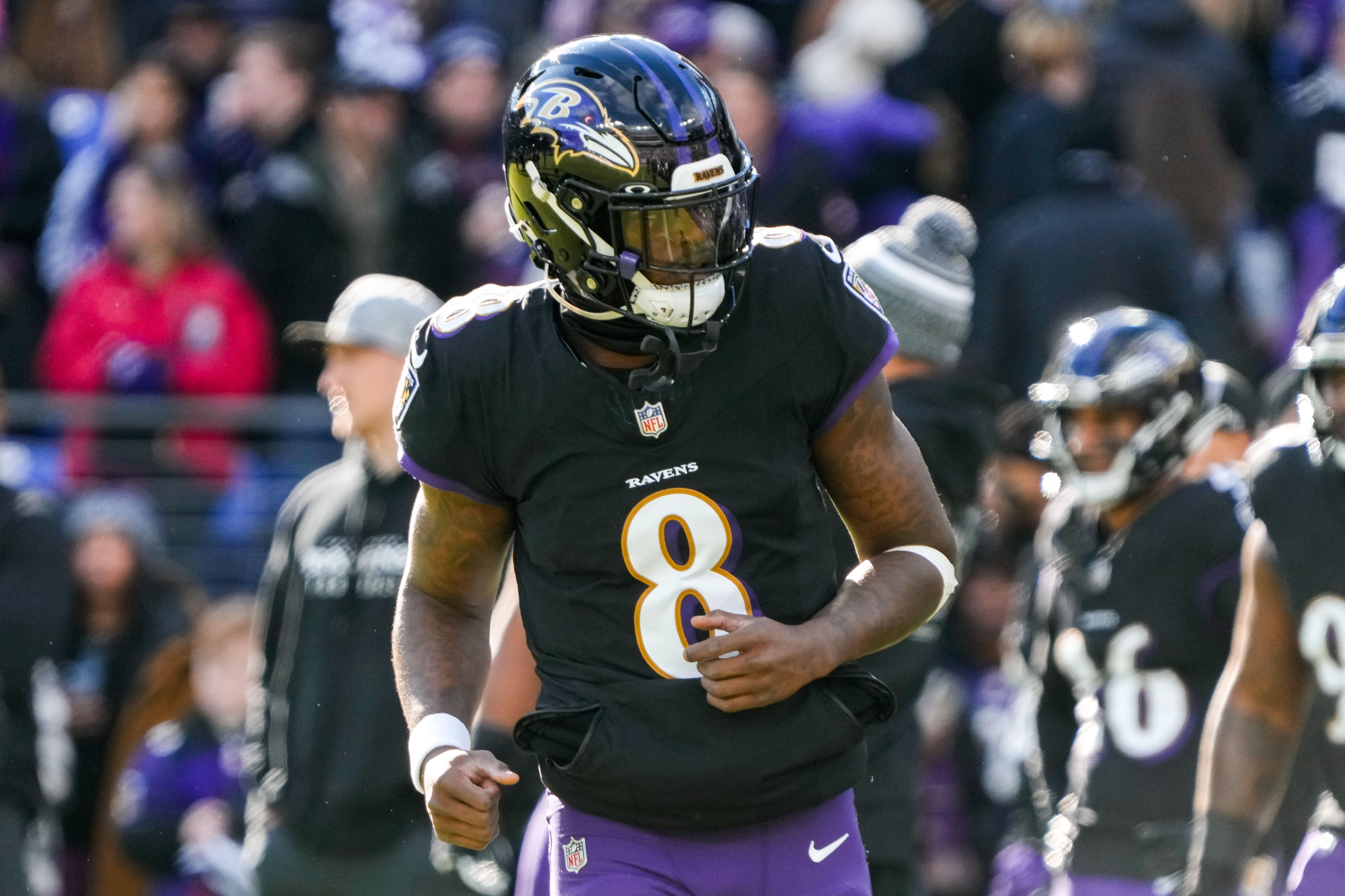 Ravens quarterback Lamar Jackson had a perfect passer rating in Sunday's rout of the Miami Dolphins, and the team clinched the AFC's top seed.
