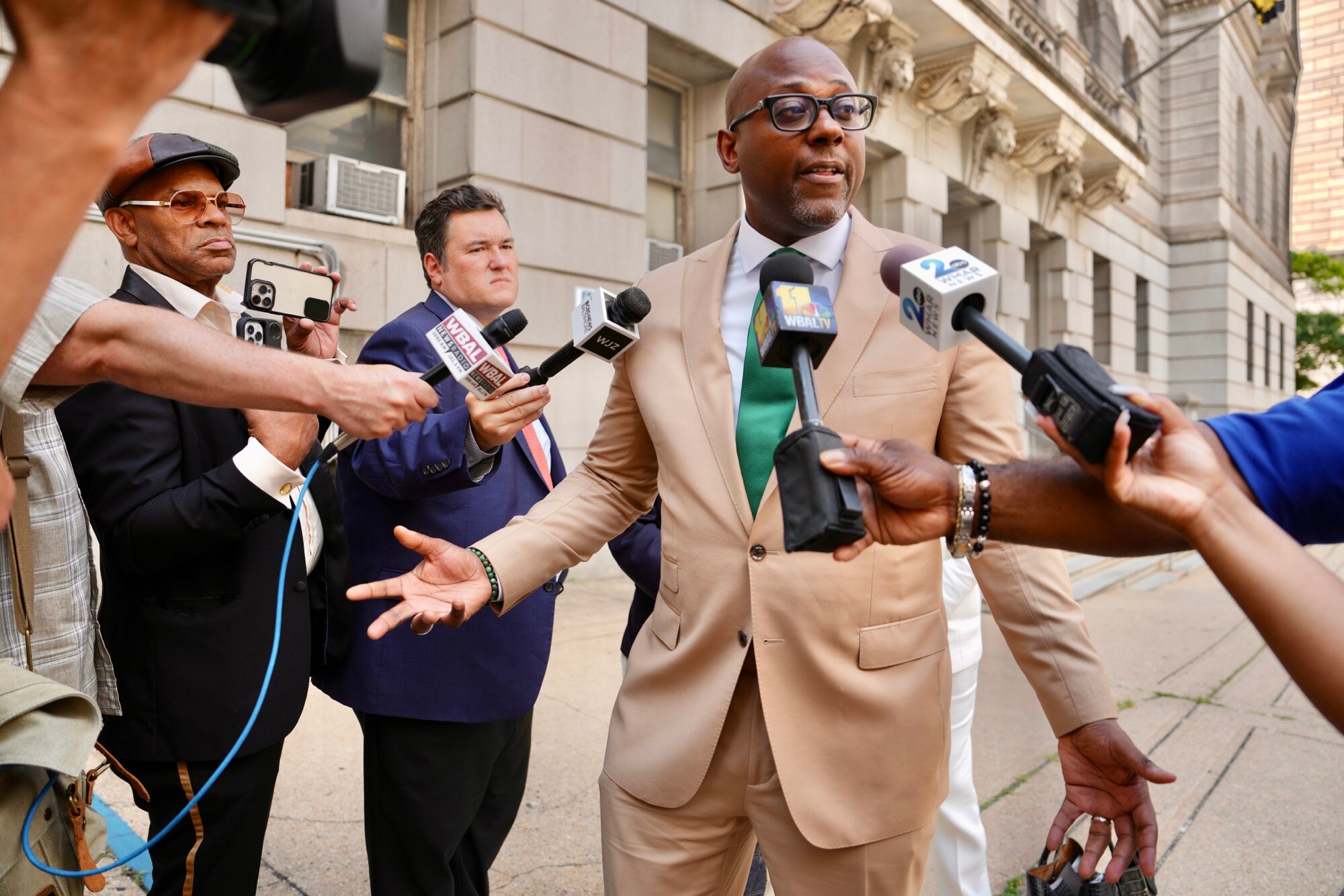 J. Wyndal Gordon, center, an attorney representing a 16-year-old charged with first-degree murder and related offenses in the shooting of Timothy Reynolds, makes a statement on Tuesday in front of the Clarence M. Mitchell Jr. Courthouse in Baltimore.