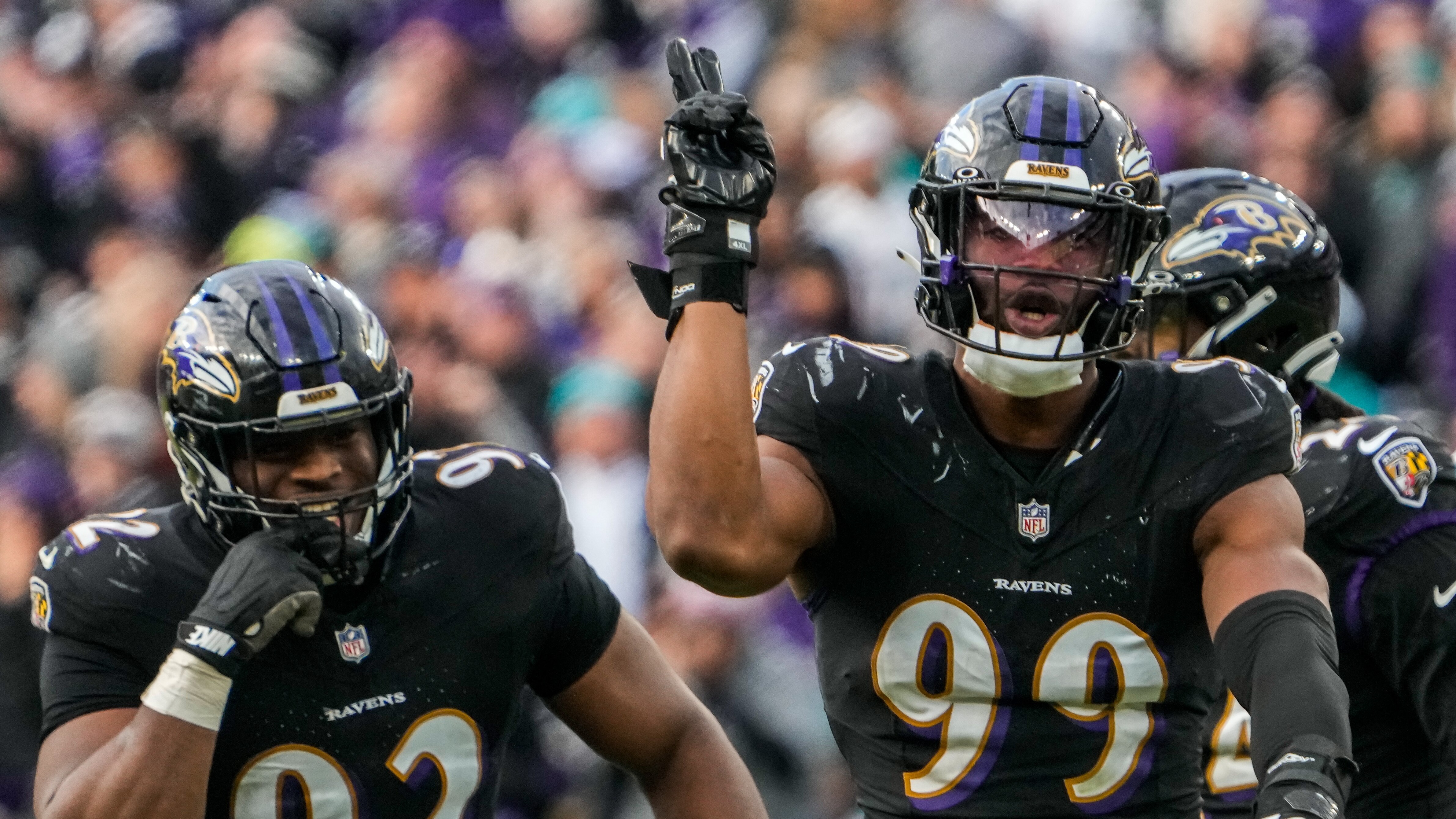 Baltimore Ravens linebacker Odafe Oweh (99) celebrates after sacking Miami Dolphins quarterback Tua Tagovailoa (1) during the fourth quarter at M&T Bank Stadium on Sunday, Dec. 31, 2023.
