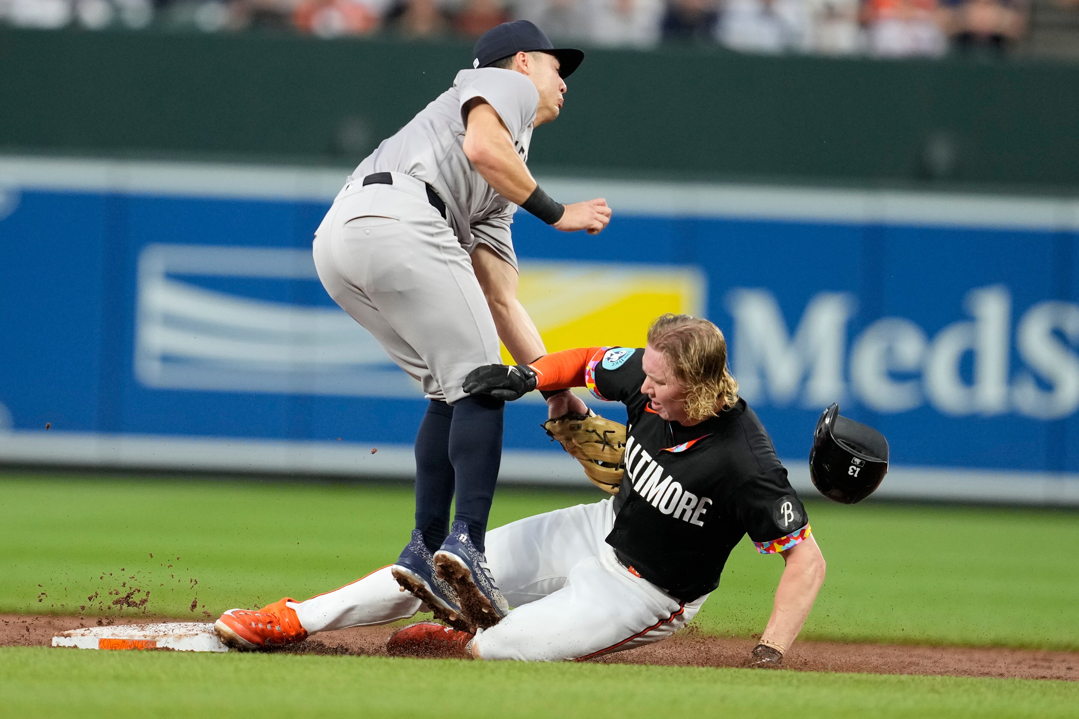 Orioles left fielder Heston Kjerstad beats the tag by Anthony Volpe of the Yankees for a second-inning stolen base. Kjerstad scored the only run for the Orioles on a triple by Ramón Urías.