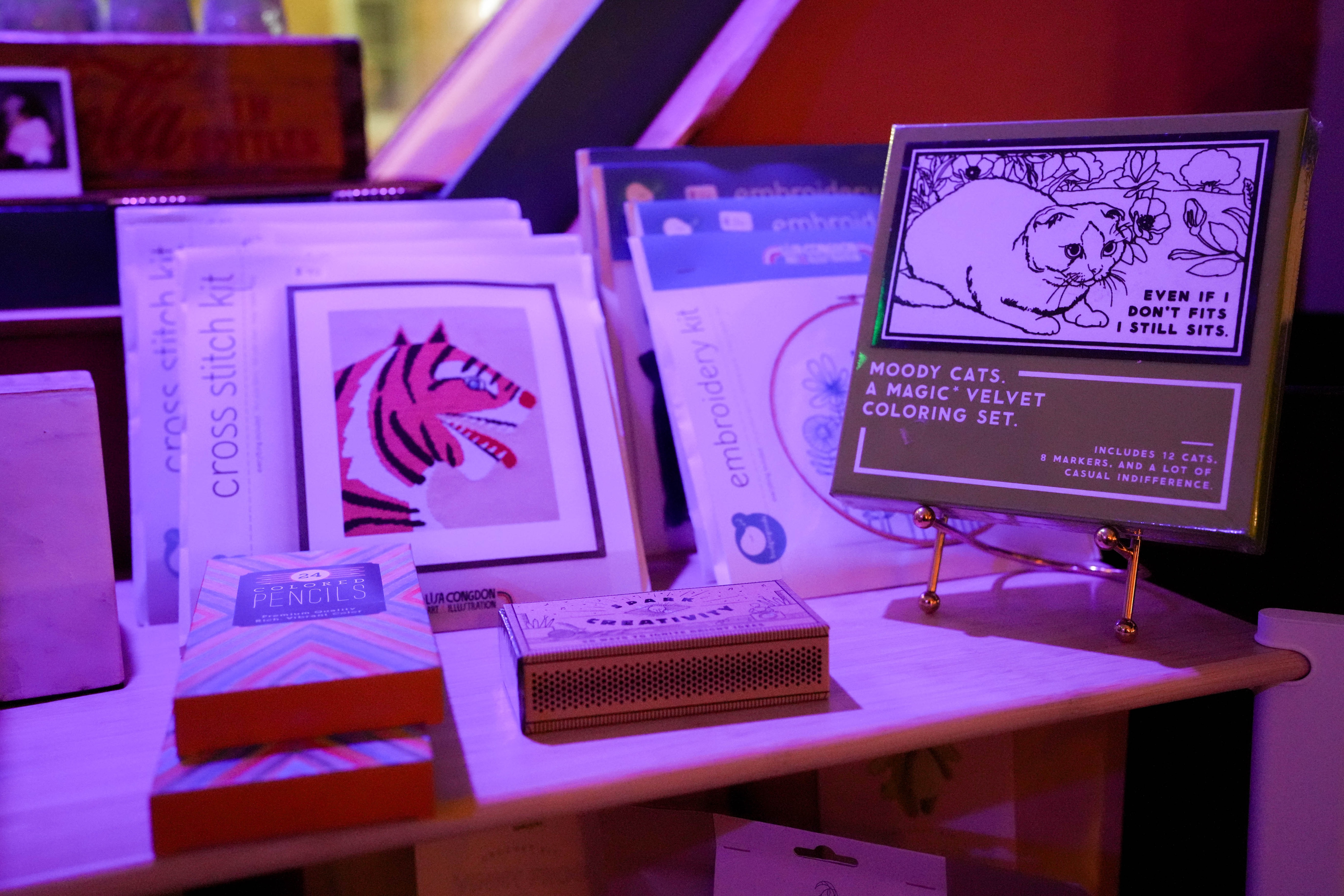 Cross stitching and coloring materials available for customers’ use inside Meander Art Bar in the Upper Fells Point neighborhood of Baltimore.