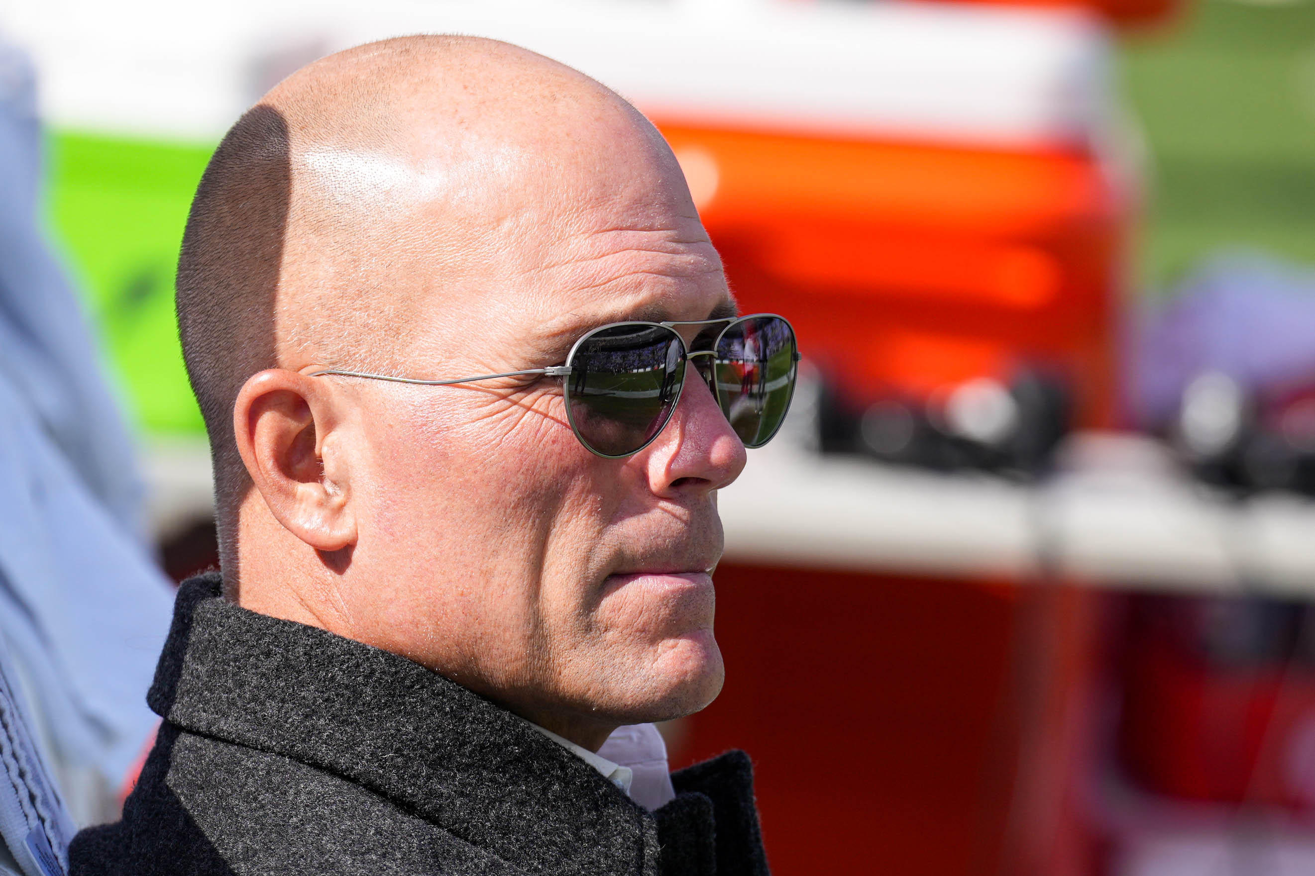 Ravens general manager Eric DeCosta sits on the bench ahead of a game against the Chicago Bears on Oct. 26.