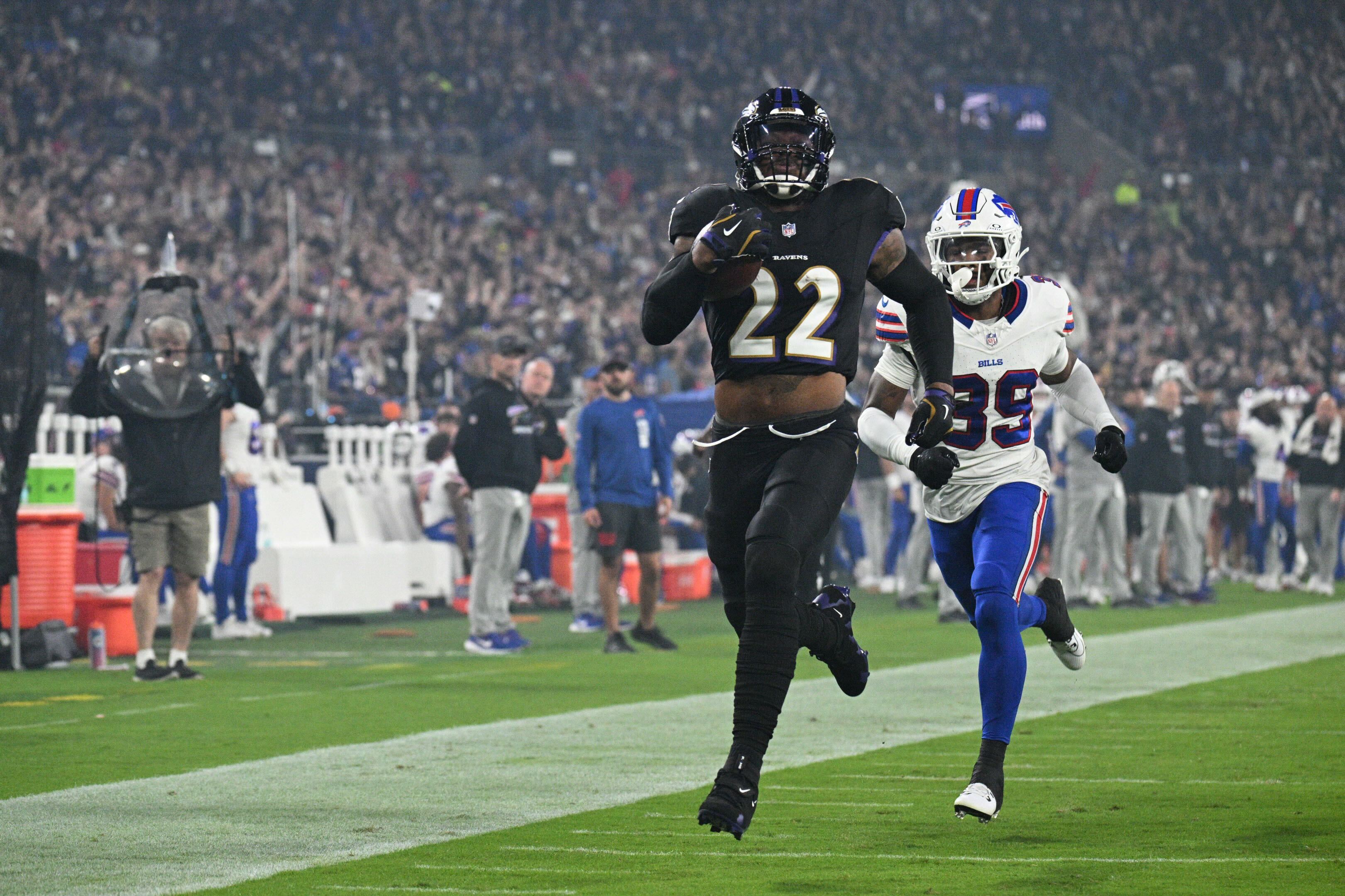 Baltimore Ravens running back Derrick Henry (22) scores a touchdown as the Ravens host the Buffalo Bills at M&T Bank Stadium Sunday night.