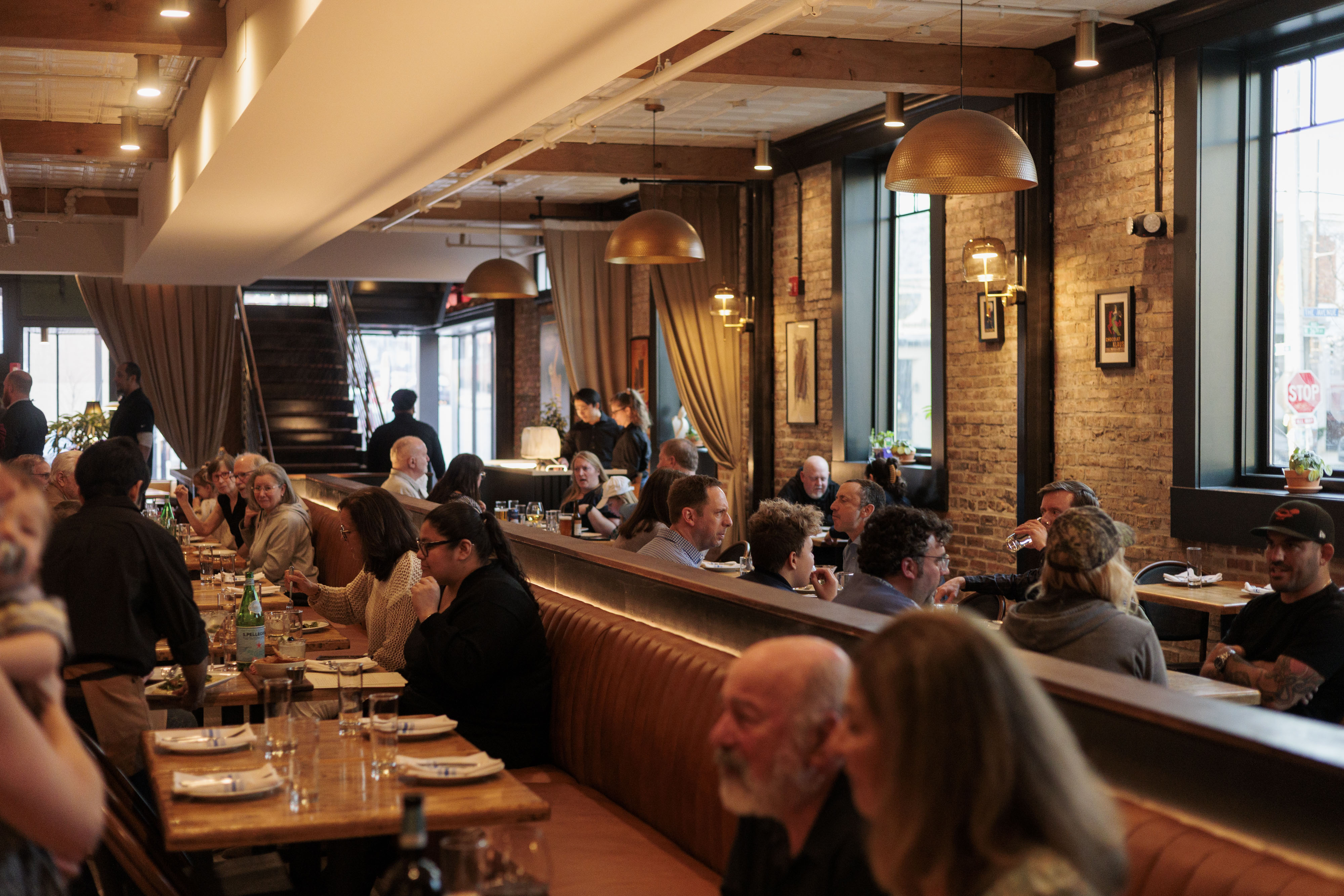 Guests attend dinner service at the soft opening of Seppia in March.