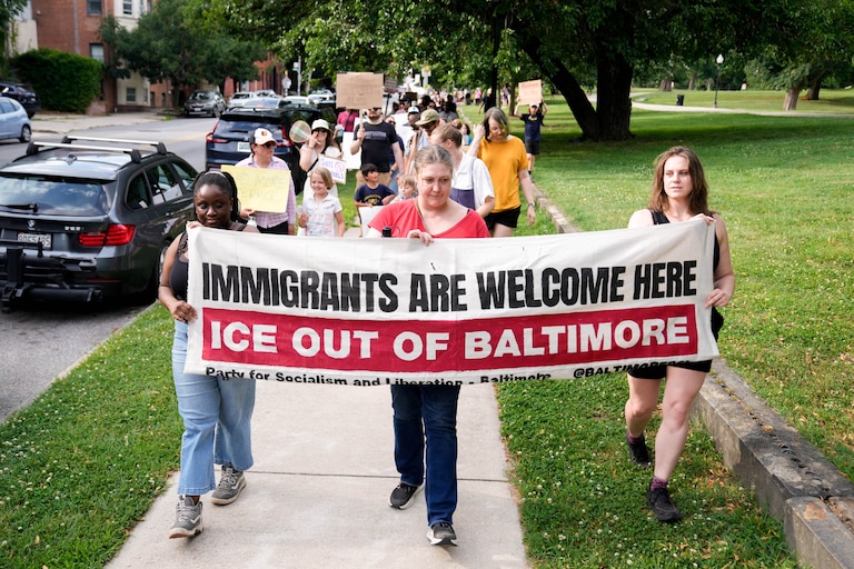 Protesters begin to march around the perimeter of Patterson Park as part of an anti-ICE rally in Baltimore, Md. on Friday, June 12, 2026. The group of community members and parents gathered a day after U.S. Immigration and Customs Enforcement arrested a student’s parents on Commodore John Rodgers Elementary/Middle School’s temporary campus in East Baltimore.