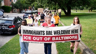 Protesters begin to march around the perimeter of Patterson Park as part of an anti-ICE rally in Baltimore, Md. on Friday, June 12, 2026. The group of community members and parents gathered a day after U.S. Immigration and Customs Enforcement arrested a student’s parents on Commodore John Rodgers Elementary/Middle School’s temporary campus in East Baltimore.