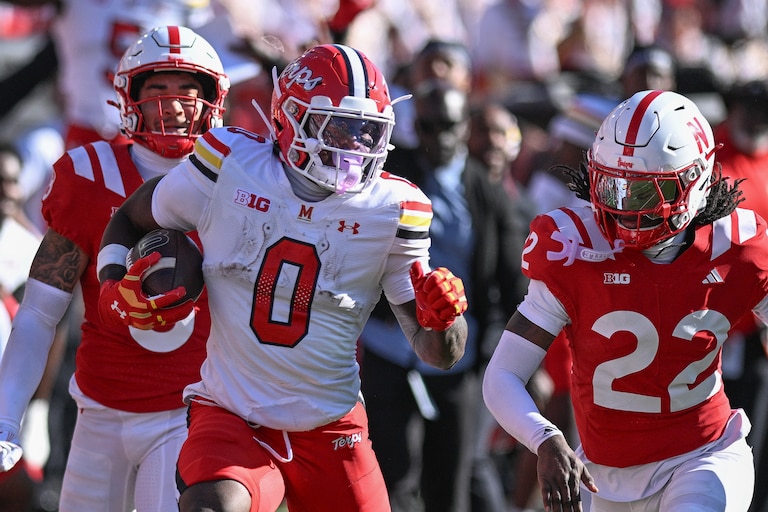 LINCOLN, NEBRASKA - OCTOBER 3: DeJuan Williams #0 of the Maryland Terrapins runs from Victor Evans III #22 of the Nebraska Cornhuskers and Donovan Jones #8 during the first half at Memorial Stadium on October 3, 2026 in Lincoln, Nebraska. (Photo by Steven Branscombe/Getty Images)