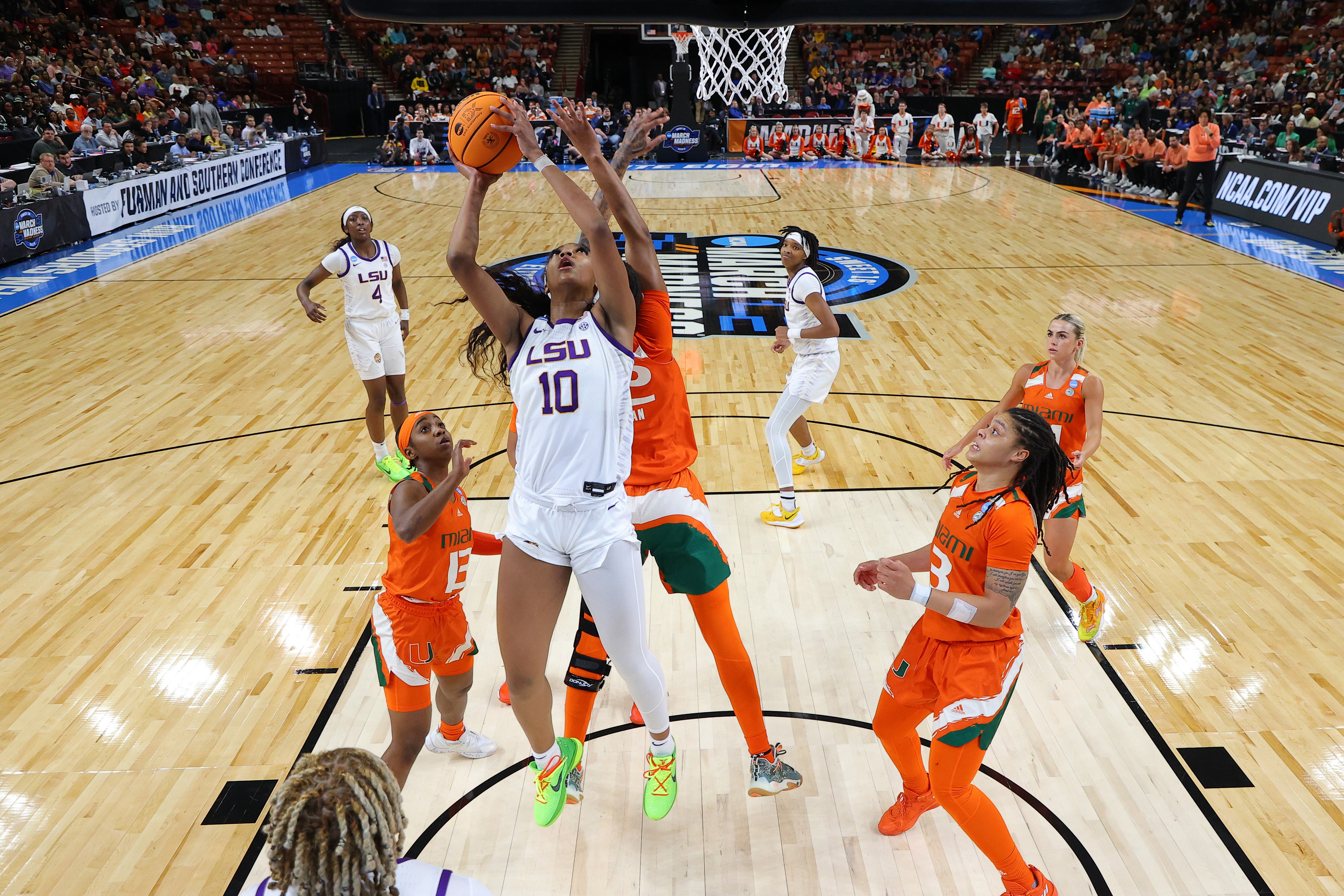 GREENVILLE, SOUTH CAROLINA - MARCH 26: Angel Reese #10 of the LSU Lady Tigers shoots the ball against the Miami Hurricanes during the third quarter in the Elite Eight round of the NCAA Women's Basketball Tournament at Bon Secours Wellness Arena on March 26, 2023 in Greenville, South Carolina.