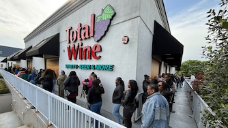 SATURDAY, MAY 2, 2026 - Lines of fans wrap around Total Wine and More in Towson for a Sable bourbon bottle signing event with Malcolm D. Lee and Morris Chestnut.